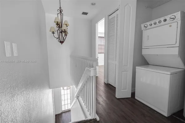 a view of entryway with wooden floor