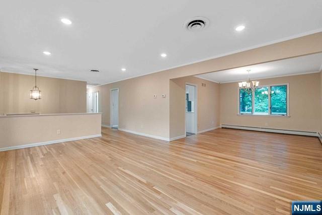 32 Rock Road Englewood Cliffs, NJ 07632 - Photo 12 of 30 a view of an empty room with wooden floor and a window