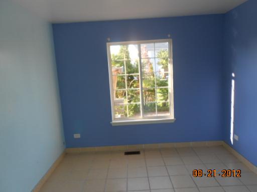 109 Fayette Court Minooka, IL 60447 - Photo 4 of 9 a view of an empty room with a window