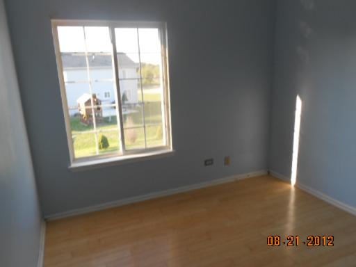 109 Fayette Court Minooka, IL 60447 - Photo 7 of 9 a view of an empty room with a window