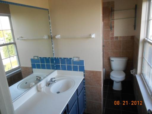 109 Fayette Court Minooka, IL 60447 - Photo 8 of 9 a bathroom with a sink toilet and shower
