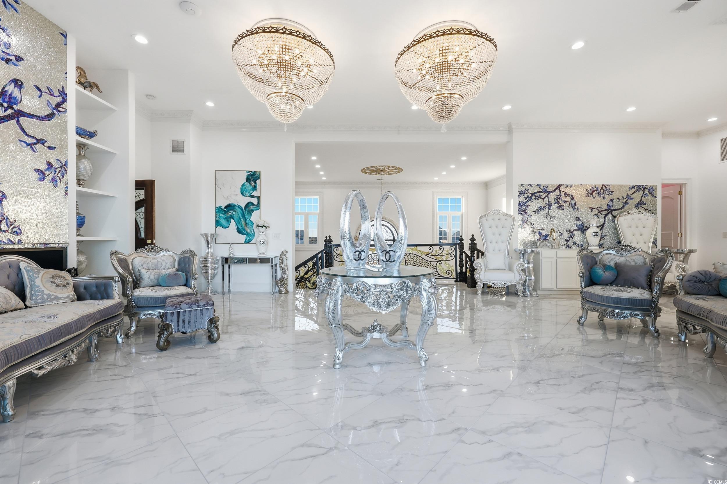 123 Pioneer Loop Georgetown, SC 29440 - Photo 21 of 40 Living area with light marble finish floors, a chandelier, ornamental molding, and recessed lighting