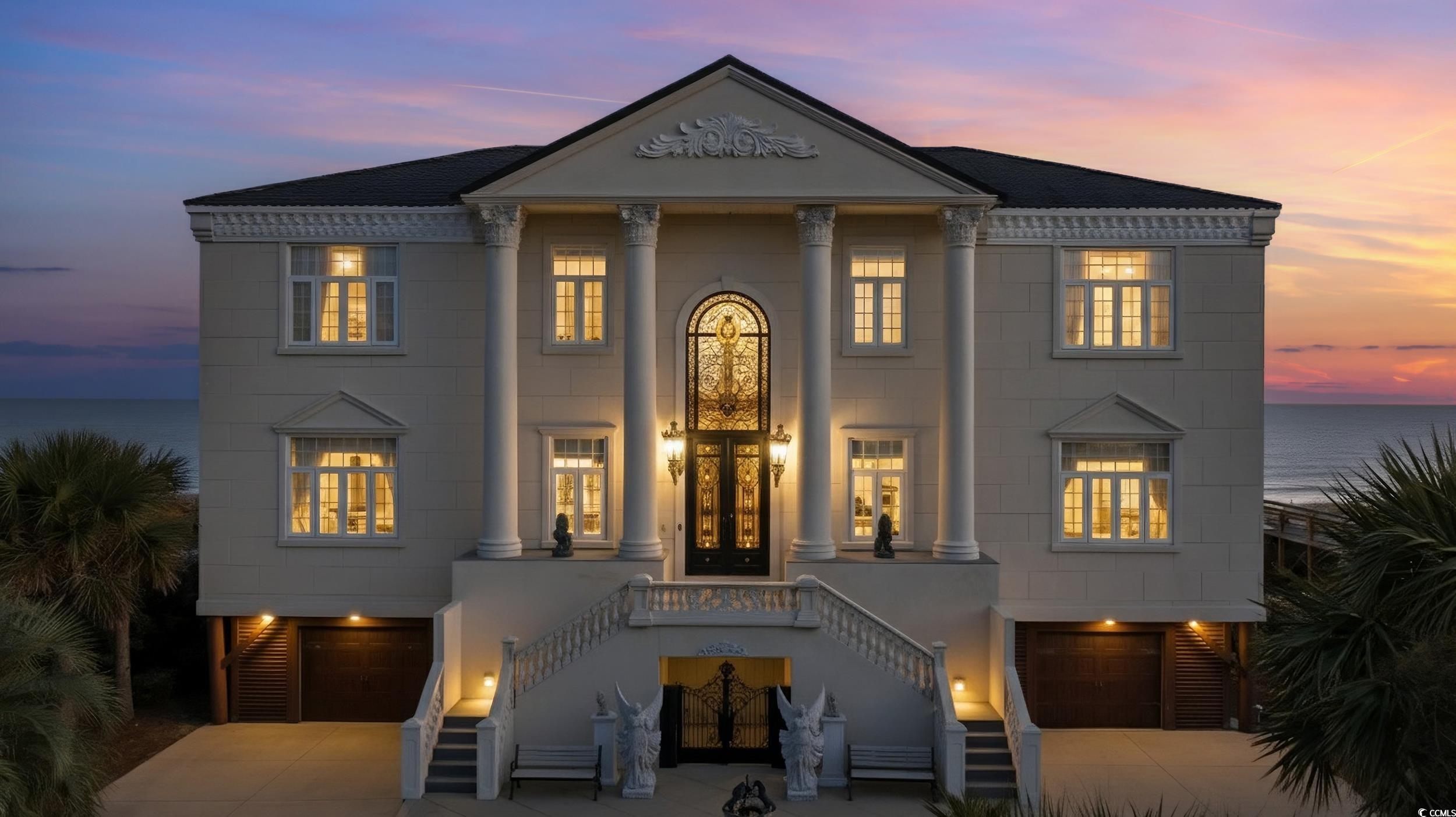 123 Pioneer Loop Georgetown, SC 29440 - Photo 40 of 40 View of front of house featuring a water view, stairs, concrete driveway, and an attached garage