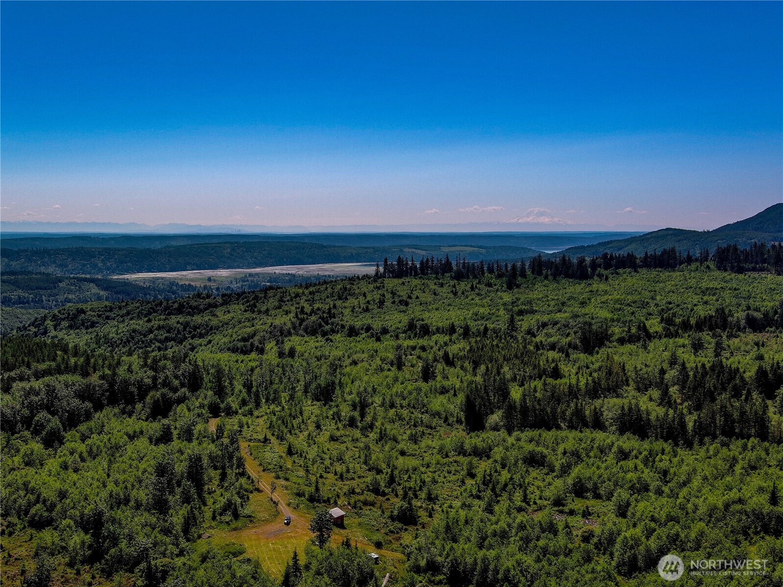 2904 Wildwood Road Quilcene, WA 98376 - Photo 16 of 39 a view of a city with lush green forest