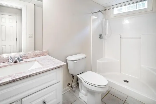 a view of livingroom with walk in closet and bathroom