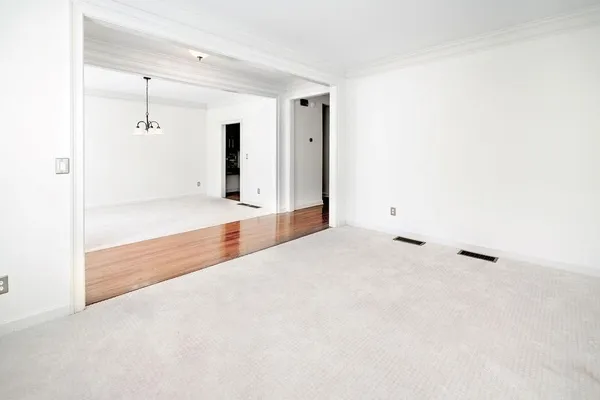 a view of a room with a ceiling fan