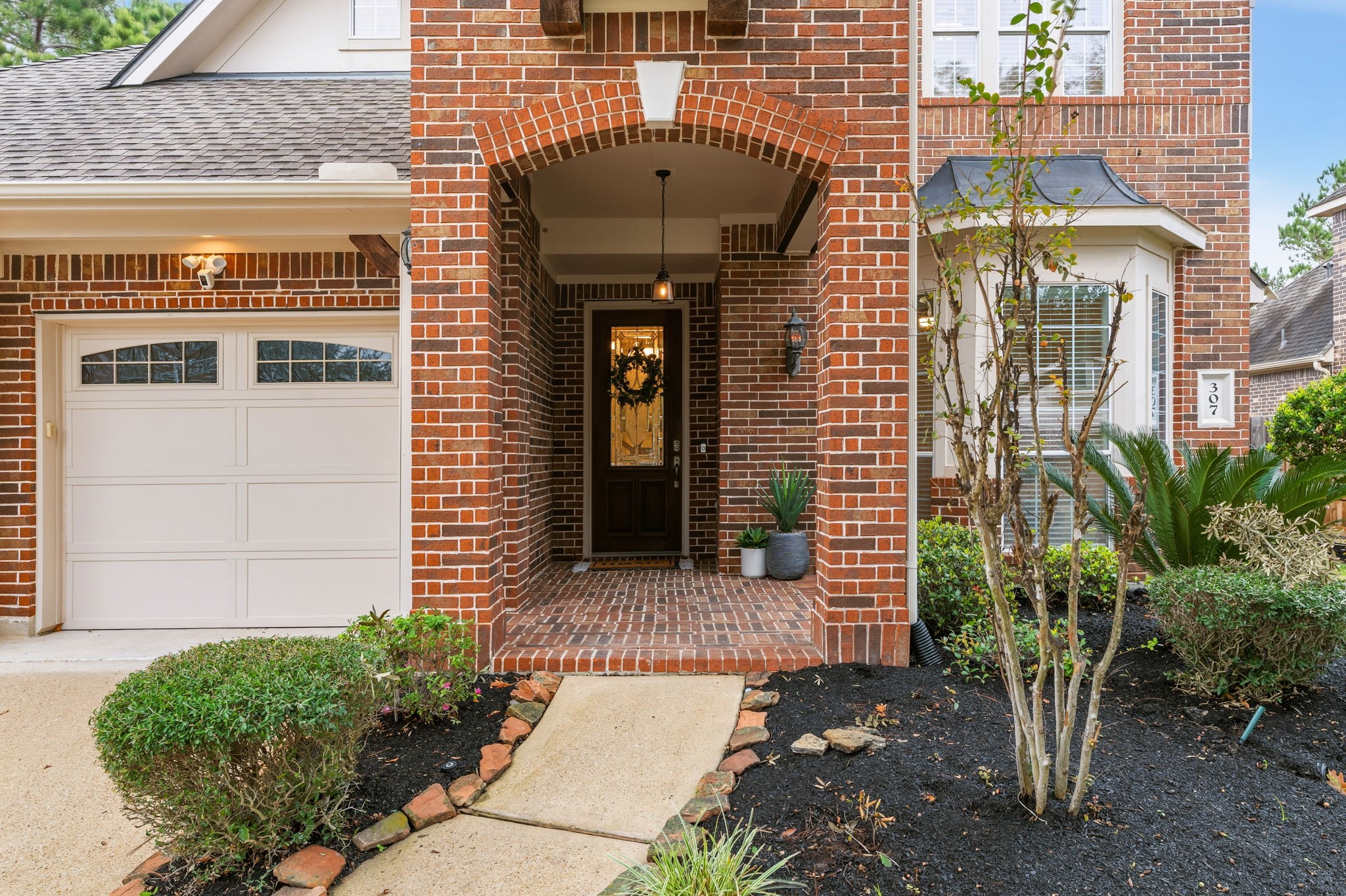 307 Arbor Ridge Lane Conroe, TX 77384 - Photo 4 of 50 a front view of a house