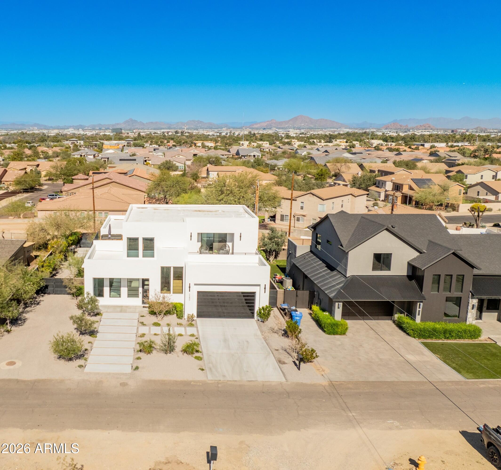 3350 East Highline Canal Road Phoenix, AZ 85042 - Photo 101 of 105 an aerial view of residential houses with a city view