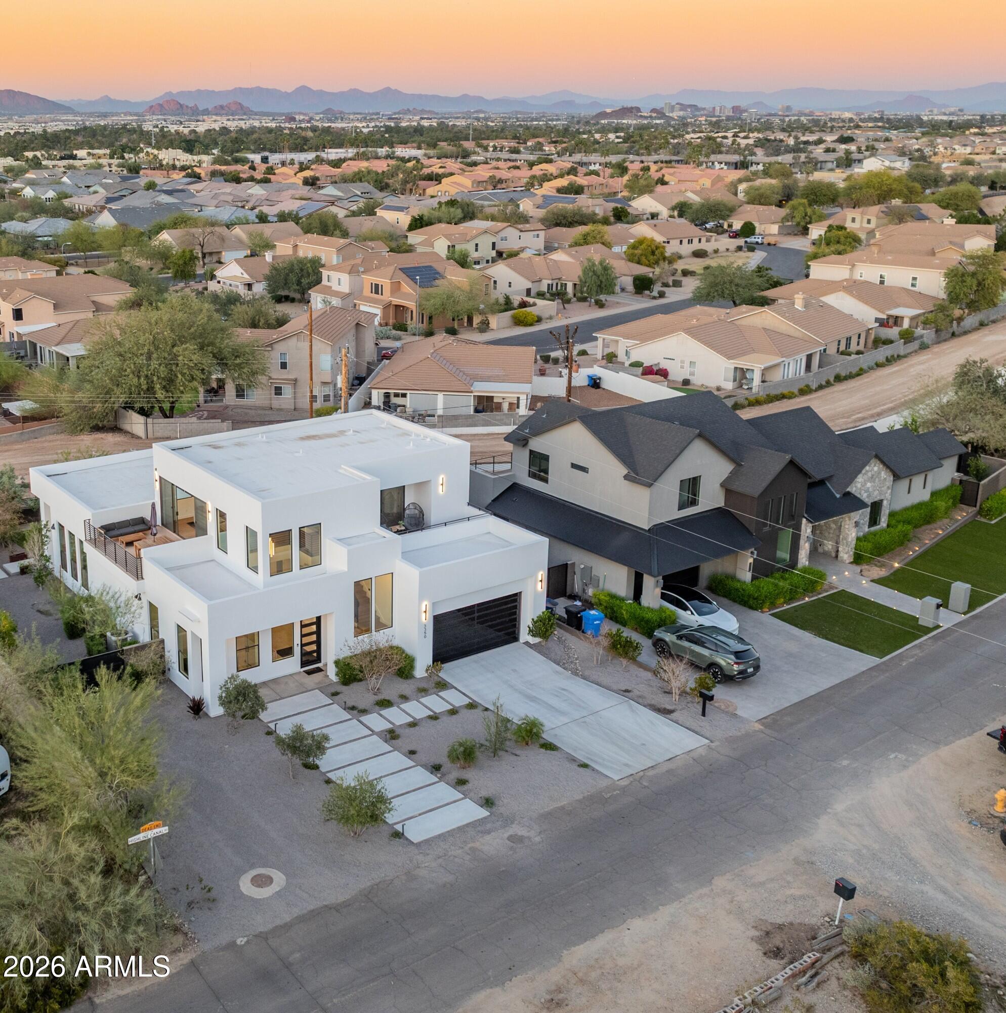 3350 East Highline Canal Road Phoenix, AZ 85042 - Photo 102 of 105 an aerial view of multiple houses with a city