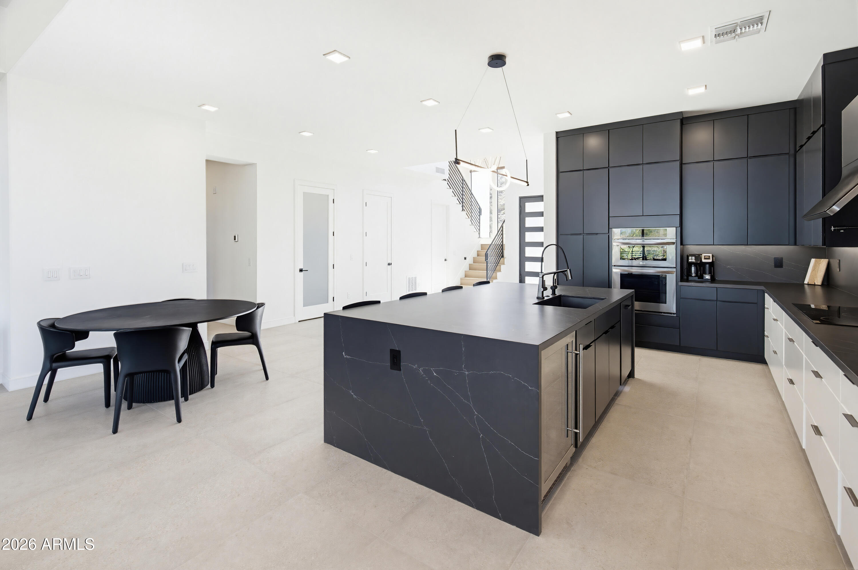 3350 East Highline Canal Road Phoenix, AZ 85042 - Photo 14 of 105 a kitchen with kitchen island granite countertop a sink counter top space appliances and a cabinets