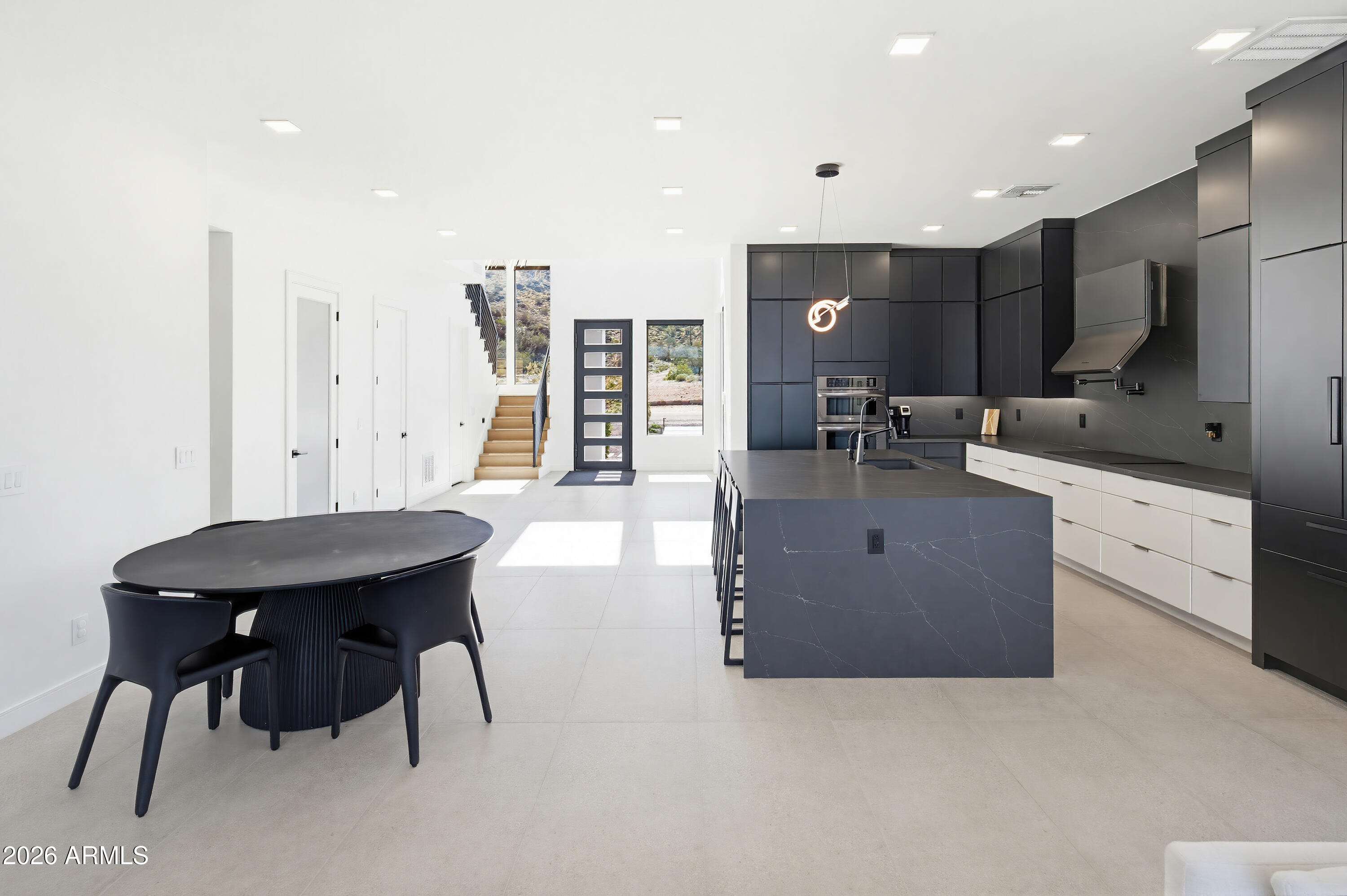 3350 East Highline Canal Road Phoenix, AZ 85042 - Photo 19 of 105 a kitchen with stainless steel appliances kitchen island granite countertop a sink and cabinets