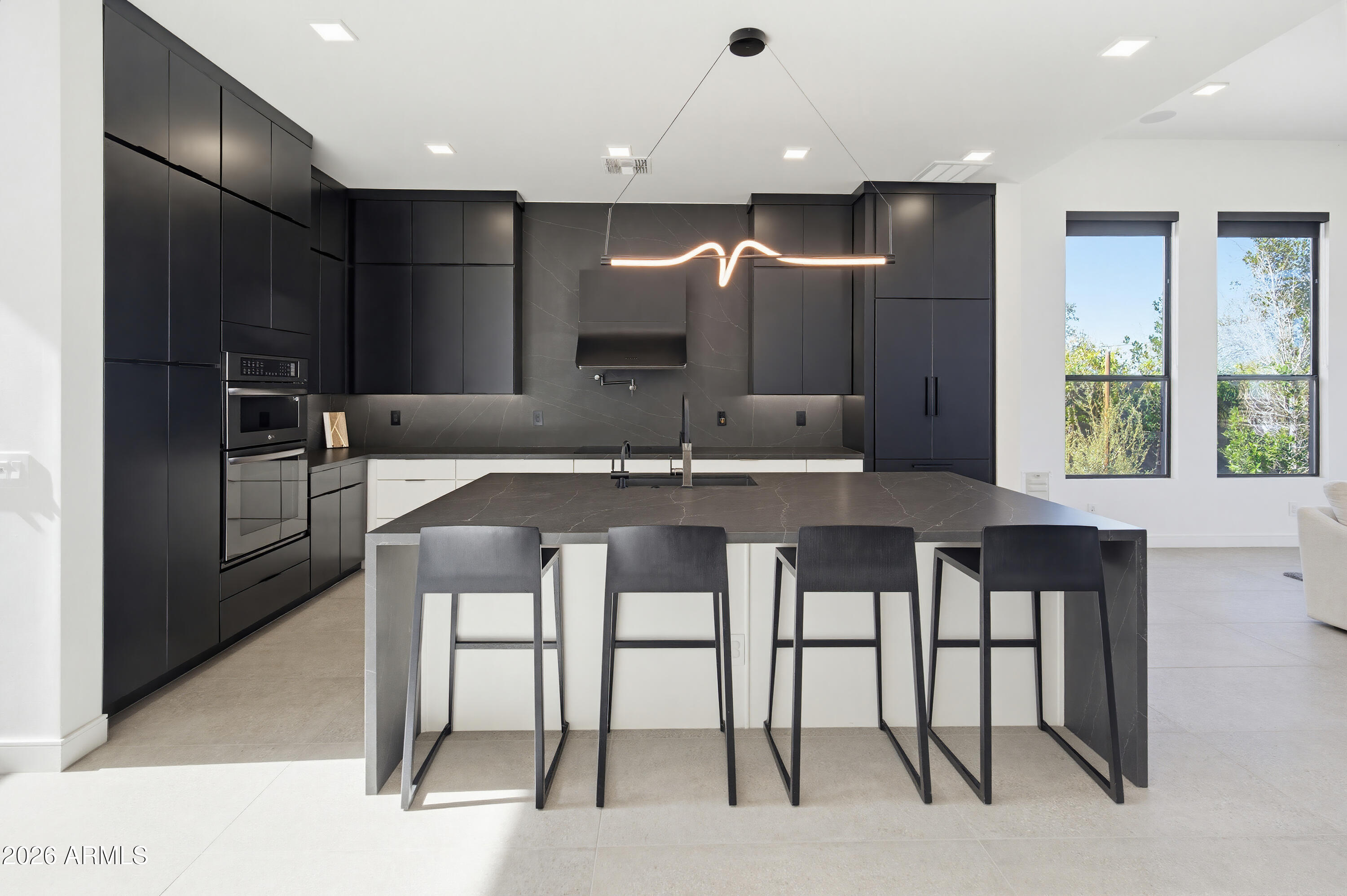 3350 East Highline Canal Road Phoenix, AZ 85042 - Photo 2 of 105 a kitchen with kitchen island granite countertop a table chairs sink and refrigerator