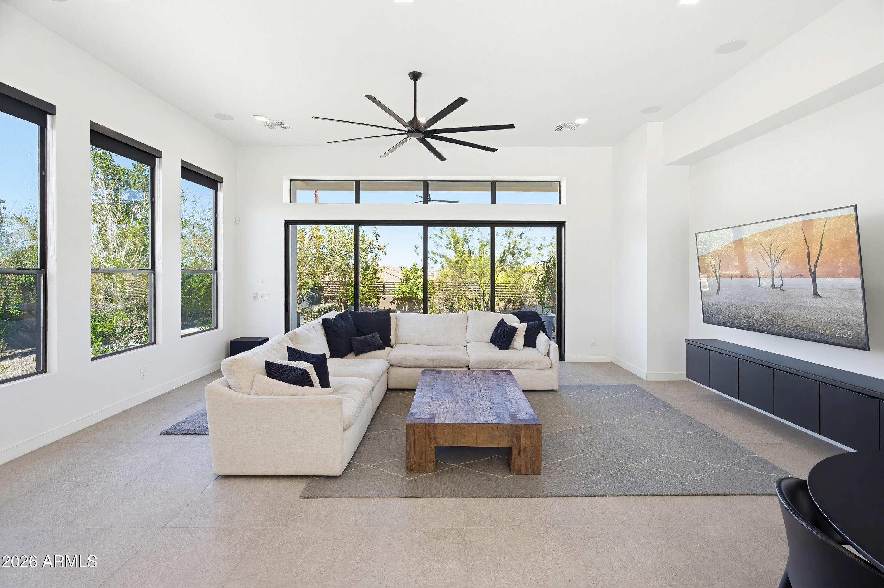 3350 East Highline Canal Road Phoenix, AZ 85042 - Photo 21 of 105 a living room with furniture and a large window