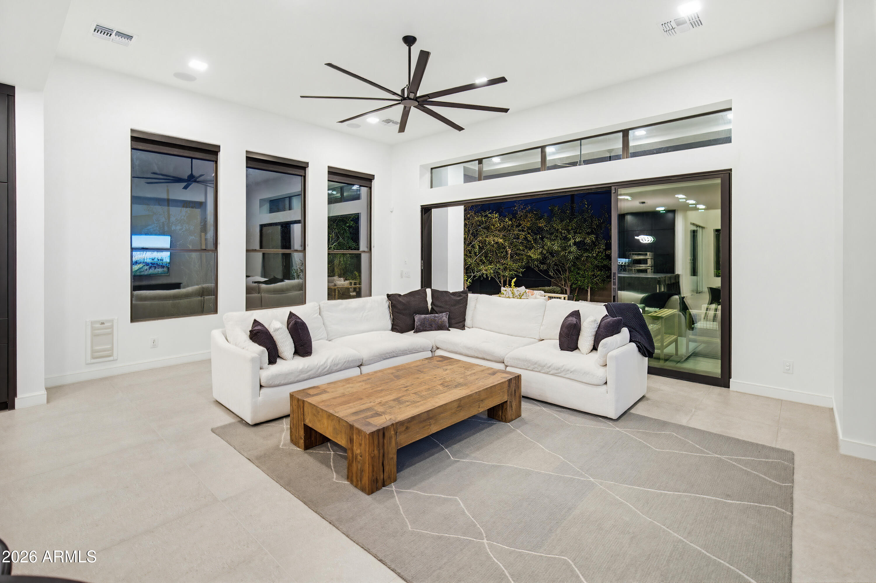 3350 East Highline Canal Road Phoenix, AZ 85042 - Photo 25 of 105 a living room with furniture a table and a large window