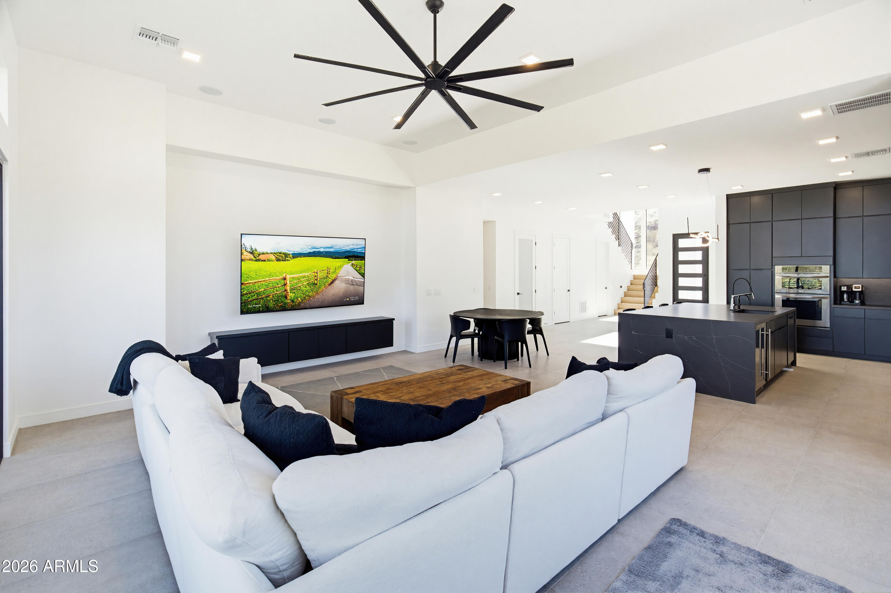 3350 East Highline Canal Road Phoenix, AZ 85042 - Photo 26 of 105 a living room with furniture and a flat screen tv