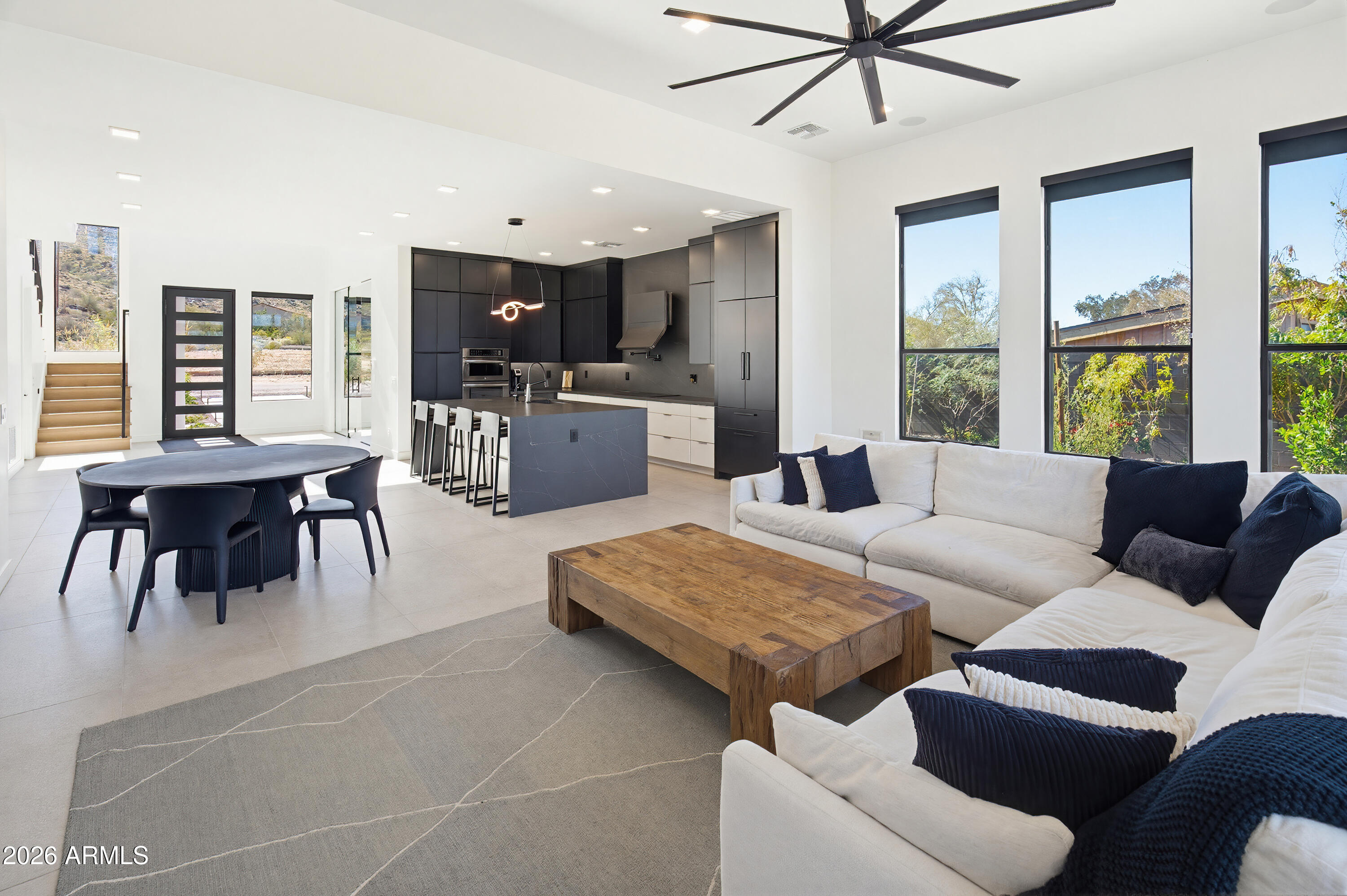 3350 East Highline Canal Road Phoenix, AZ 85042 - Photo 27 of 105 a living room with furniture and a large window