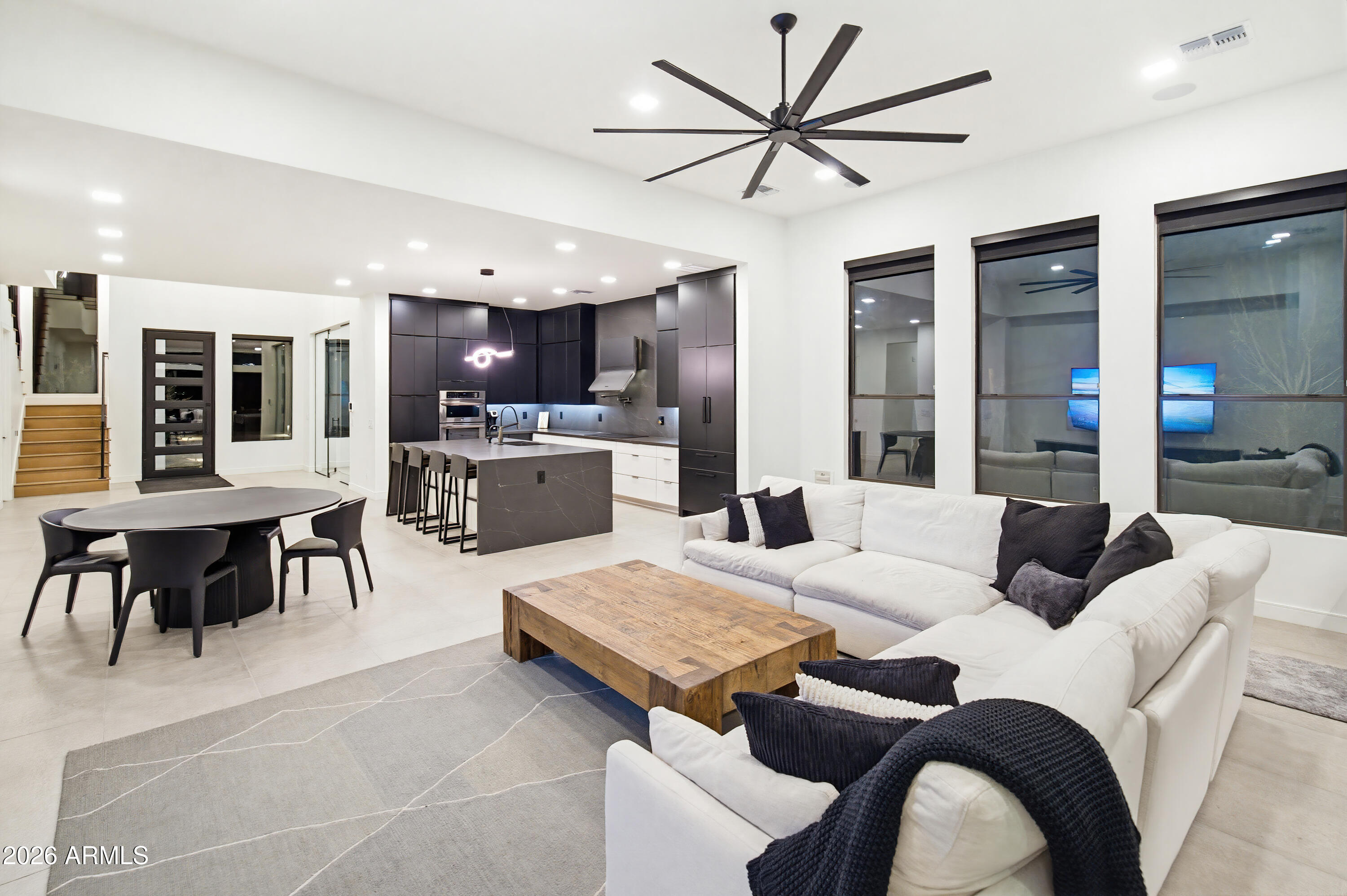3350 East Highline Canal Road Phoenix, AZ 85042 - Photo 28 of 105 a living room with couches and kitchen view with kitchen countertops