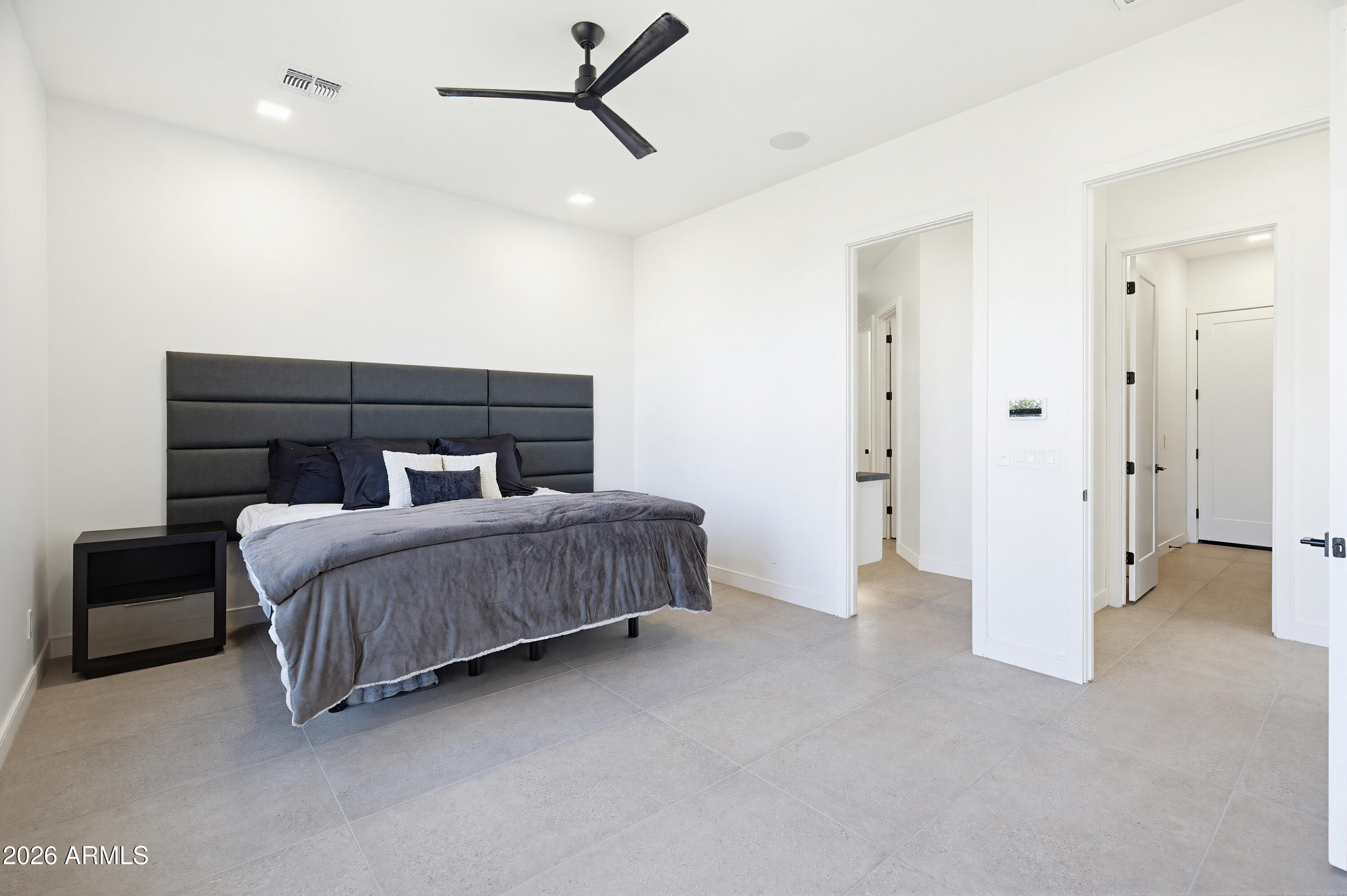 3350 East Highline Canal Road Phoenix, AZ 85042 - Photo 29 of 105 a bedroom with a bed and cabinets