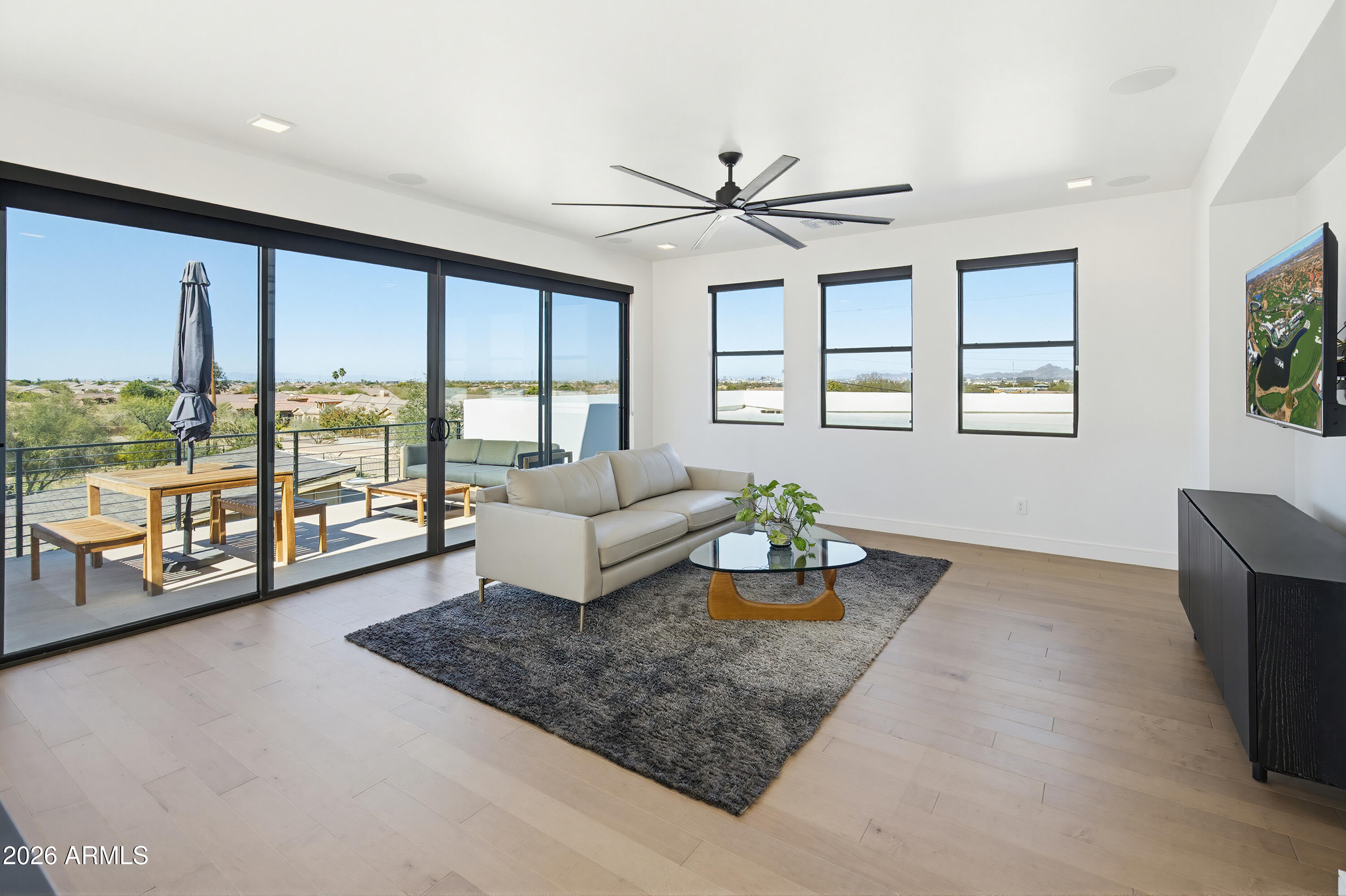 3350 East Highline Canal Road Phoenix, AZ 85042 - Photo 36 of 105 a living room with furniture and floor to ceiling windows