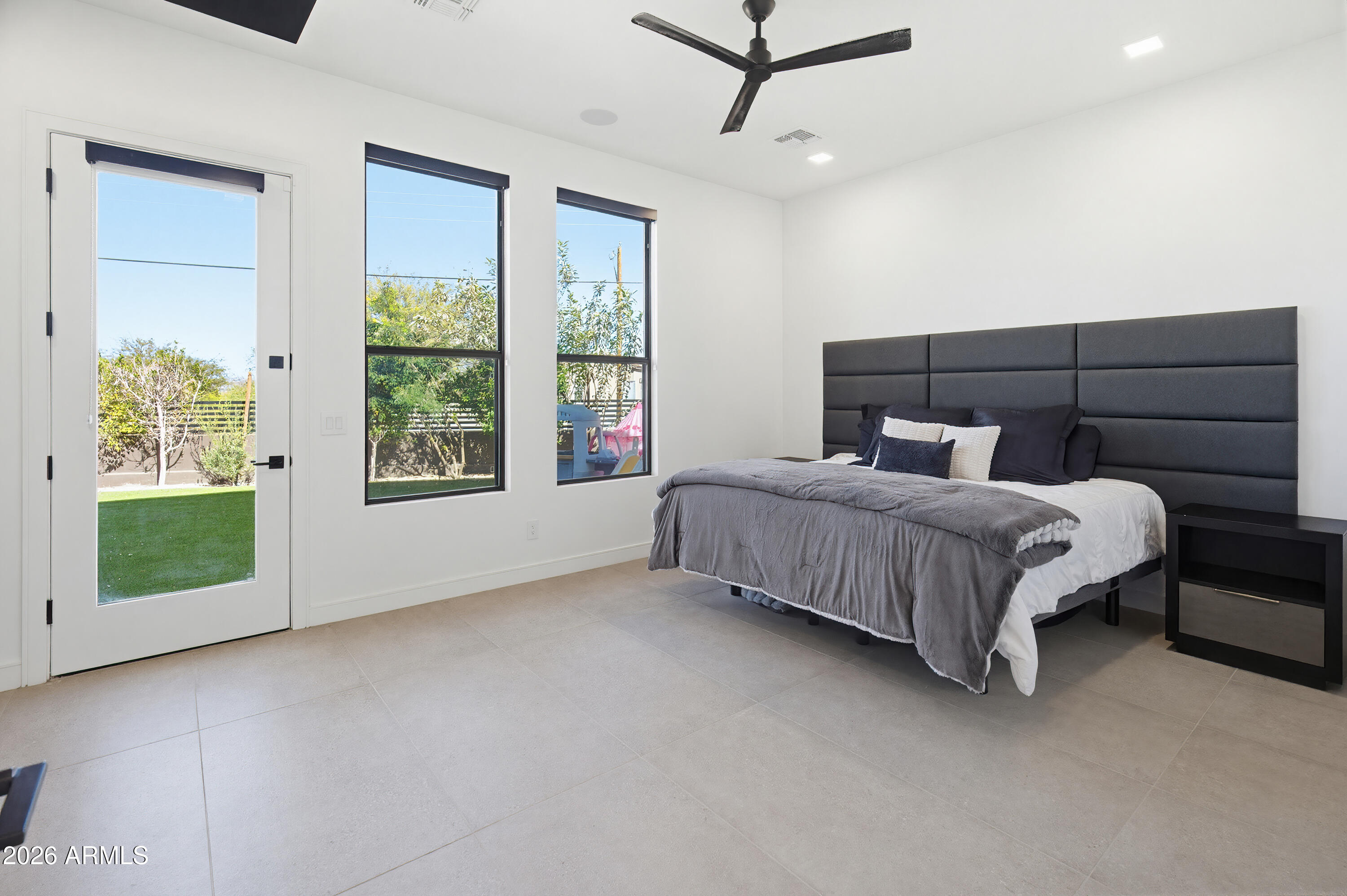 3350 East Highline Canal Road Phoenix, AZ 85042 - Photo 4 of 105 a bedroom with a bed and a window