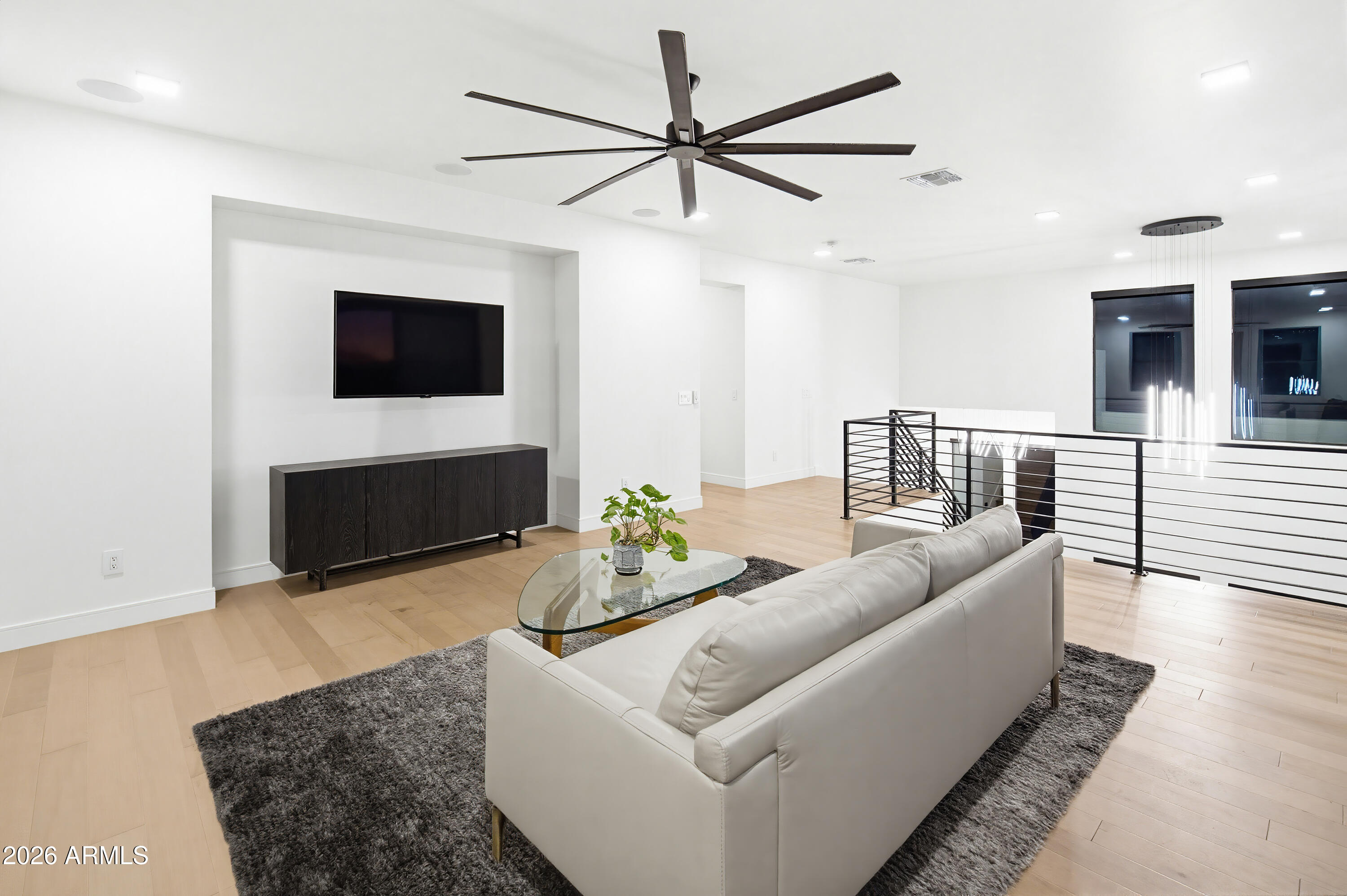 3350 East Highline Canal Road Phoenix, AZ 85042 - Photo 42 of 105 a living room with furniture a flat screen tv and a fireplace