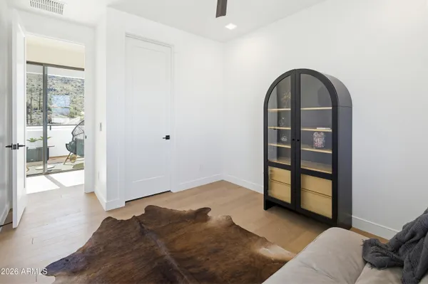 a living room with furniture a rug and a fireplace
