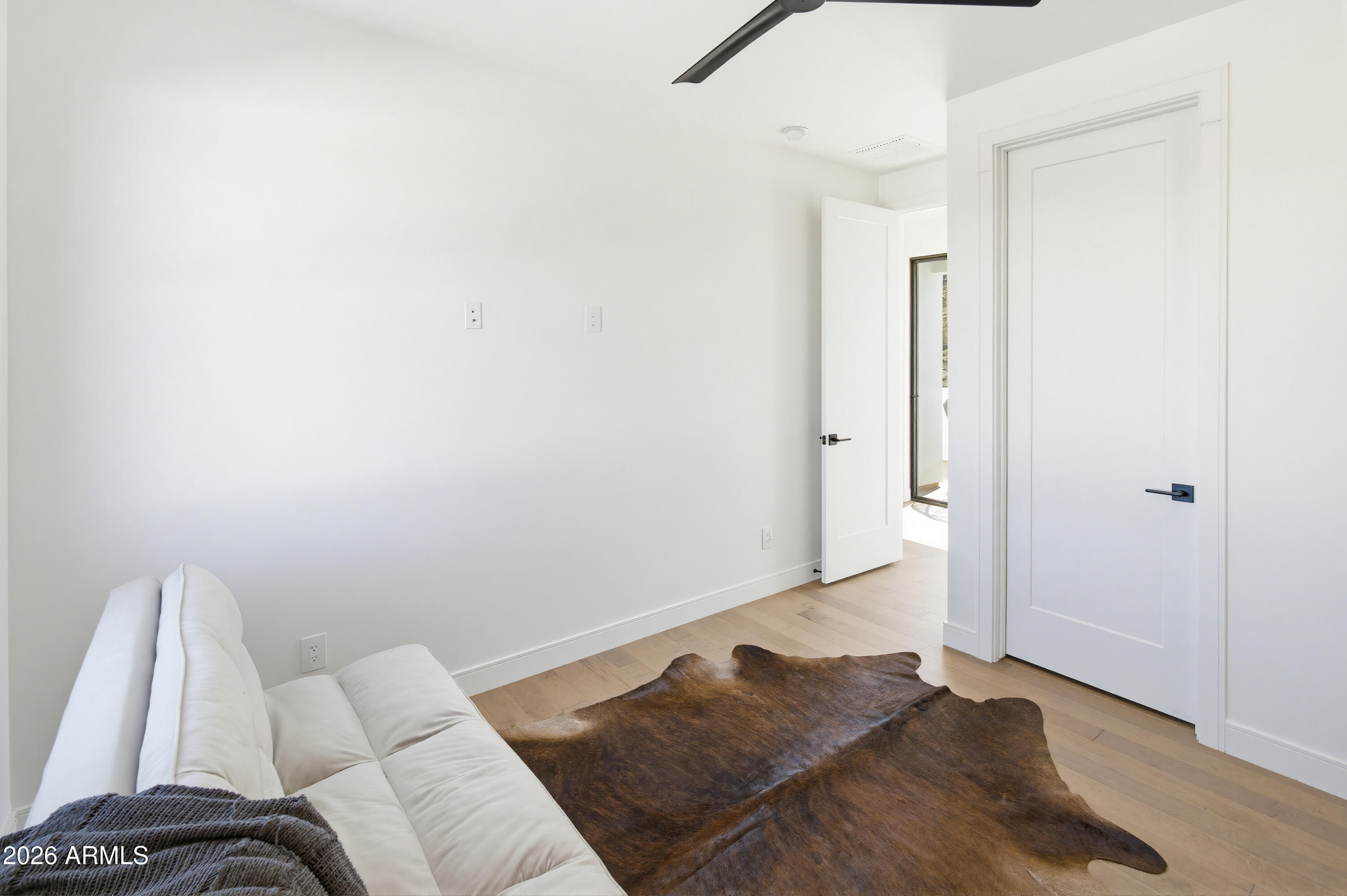 3350 East Highline Canal Road Phoenix, AZ 85042 - Photo 49 of 105 a living room with a bed and a couch