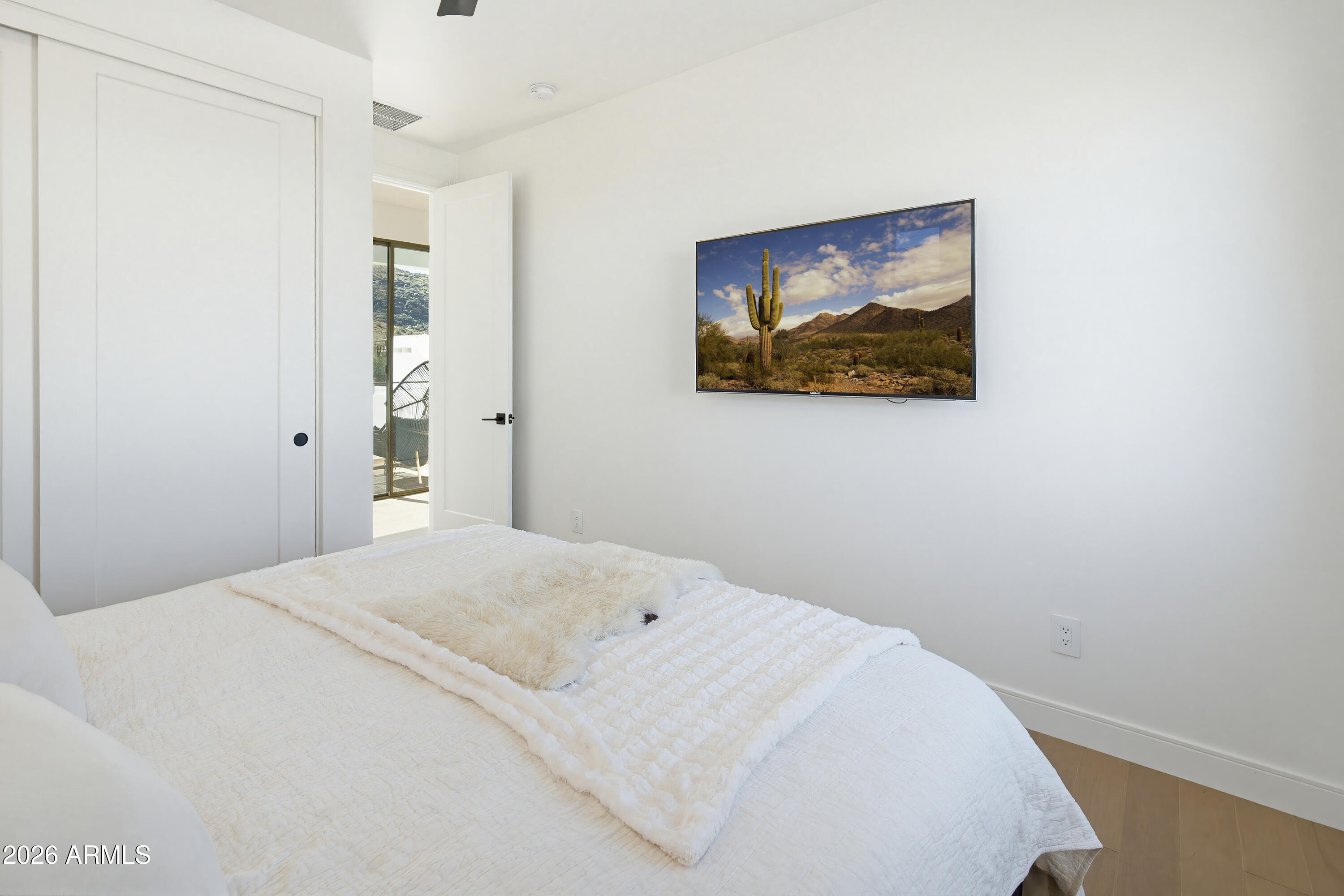 3350 East Highline Canal Road Phoenix, AZ 85042 - Photo 50 of 105 a bedroom with a bed and wall painting