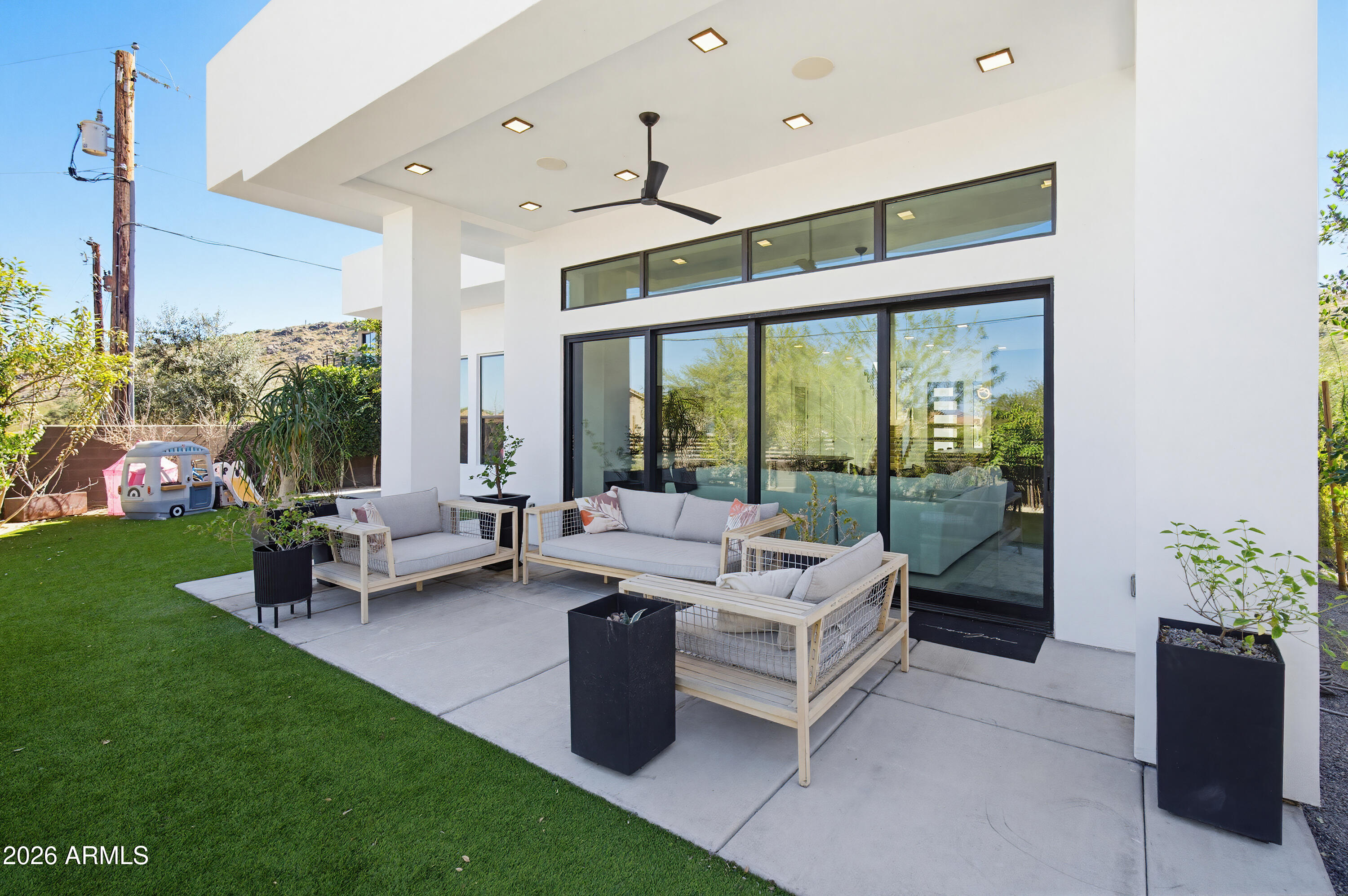 3350 East Highline Canal Road Phoenix, AZ 85042 - Photo 65 of 105 a living room with patio furniture and garden