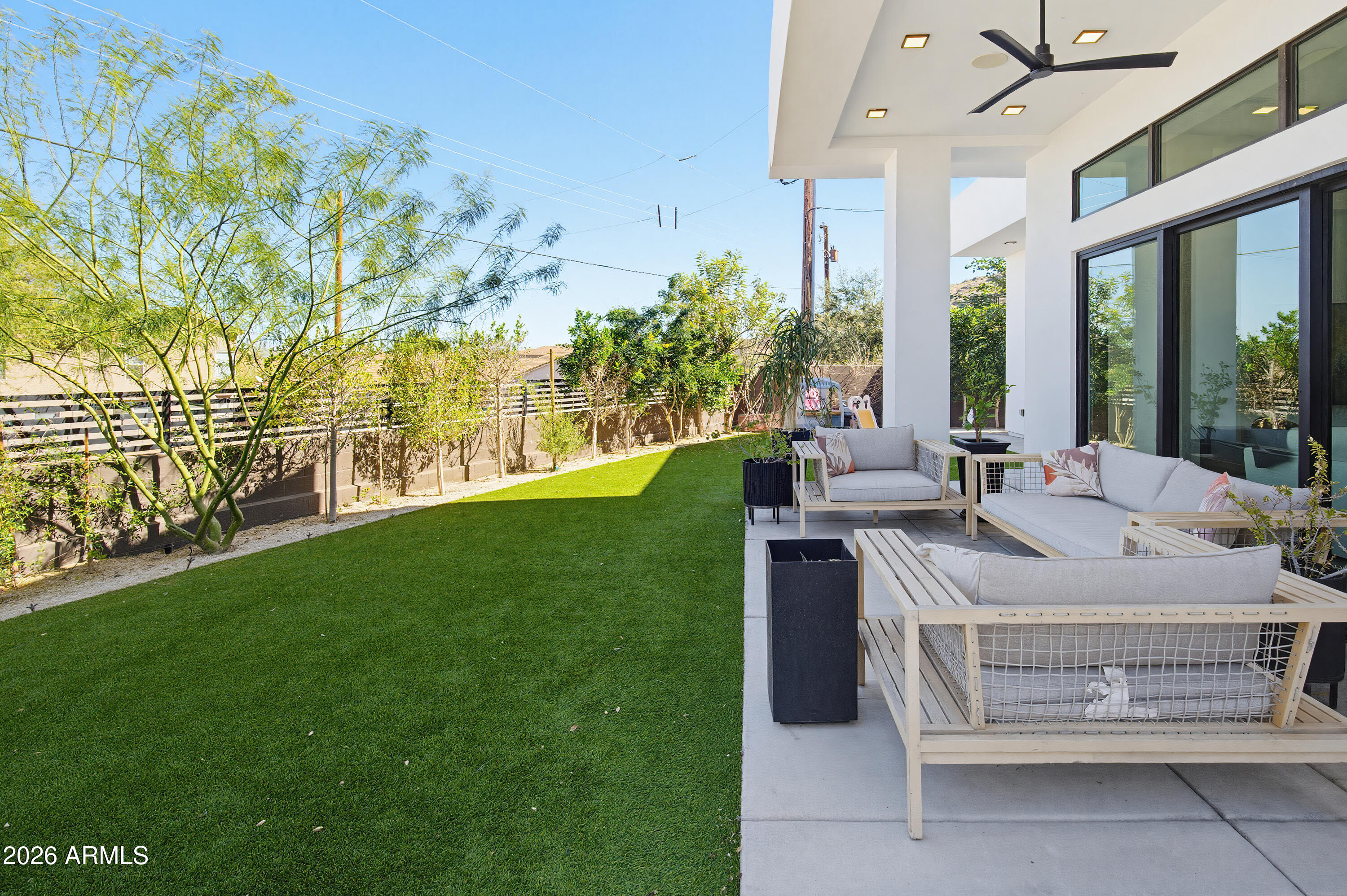 3350 East Highline Canal Road Phoenix, AZ 85042 - Photo 66 of 105 a view of a patio with table and chairs and garden