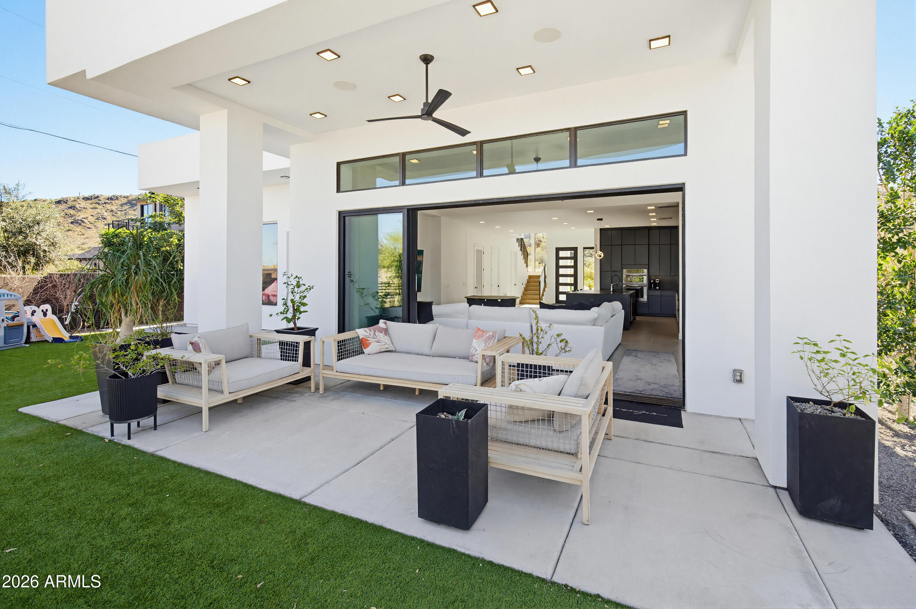 3350 East Highline Canal Road Phoenix, AZ 85042 - Photo 68 of 105 a living room with furniture potted plant and a window