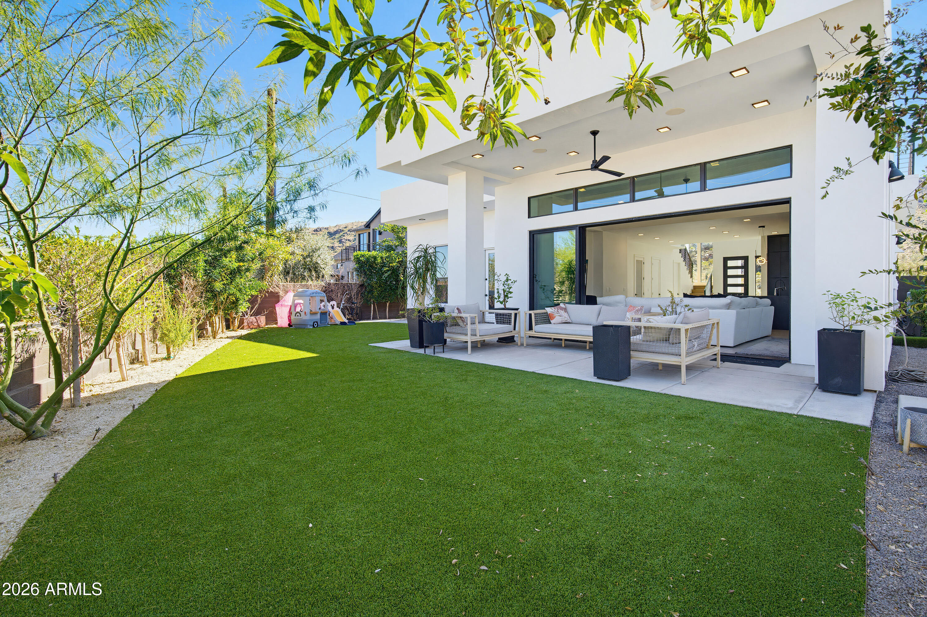 3350 East Highline Canal Road Phoenix, AZ 85042 - Photo 69 of 105 a view of a house with a backyard porch and sitting area