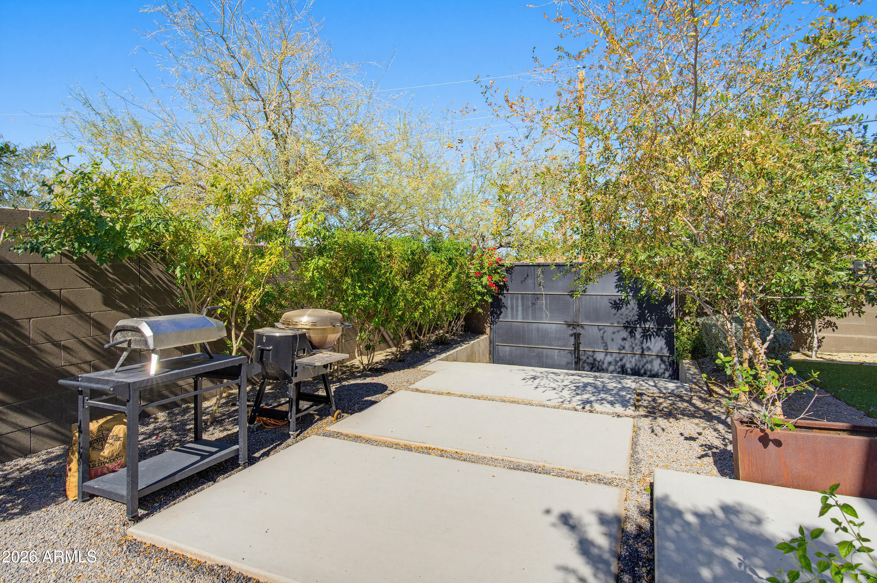 3350 East Highline Canal Road Phoenix, AZ 85042 - Photo 78 of 105 a view of a patio with table and chairs and potted plants