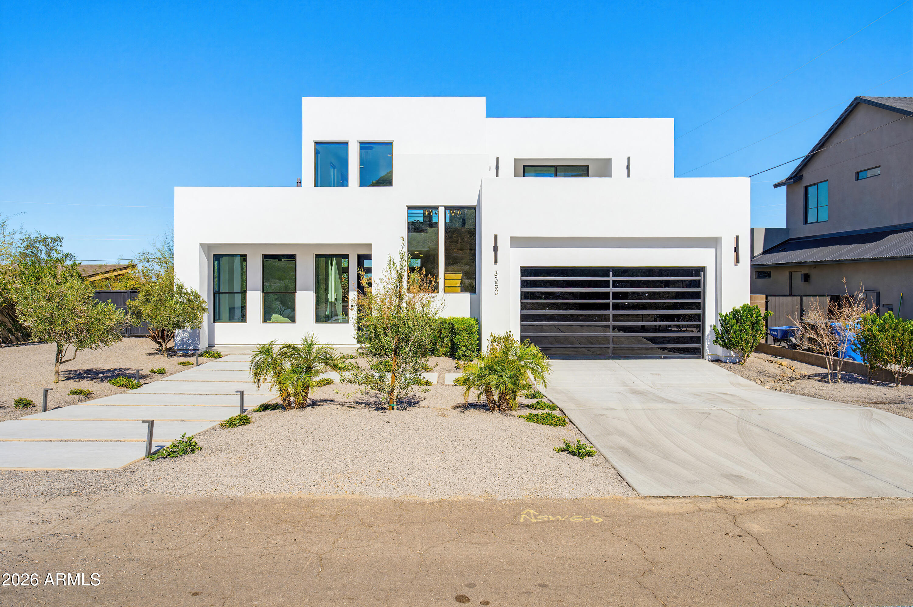 3350 East Highline Canal Road Phoenix, AZ 85042 - Photo 84 of 105 a front view of a house with a yard and a garage