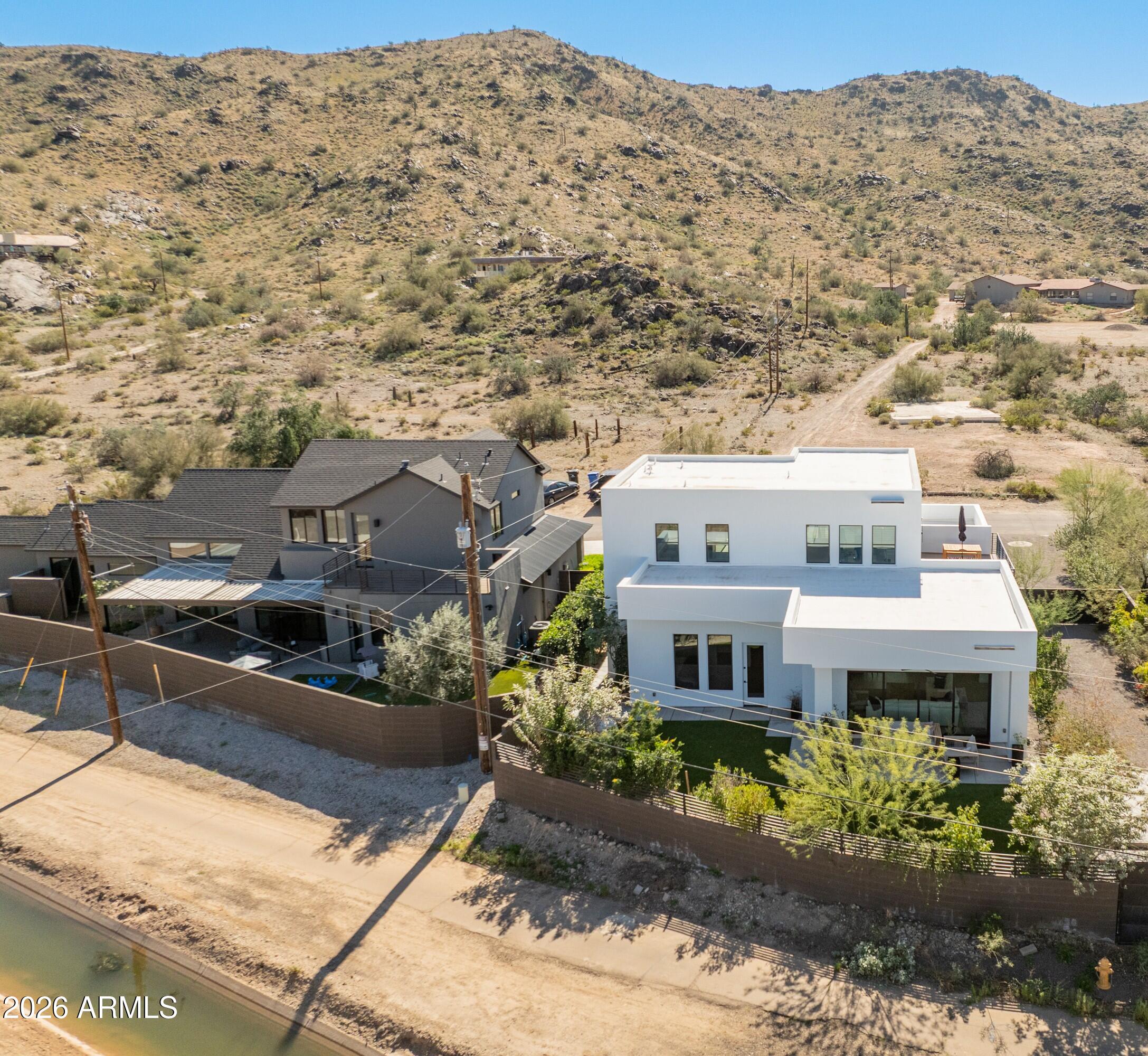 3350 East Highline Canal Road Phoenix, AZ 85042 - Photo 95 of 105 a front view of a house with a yard