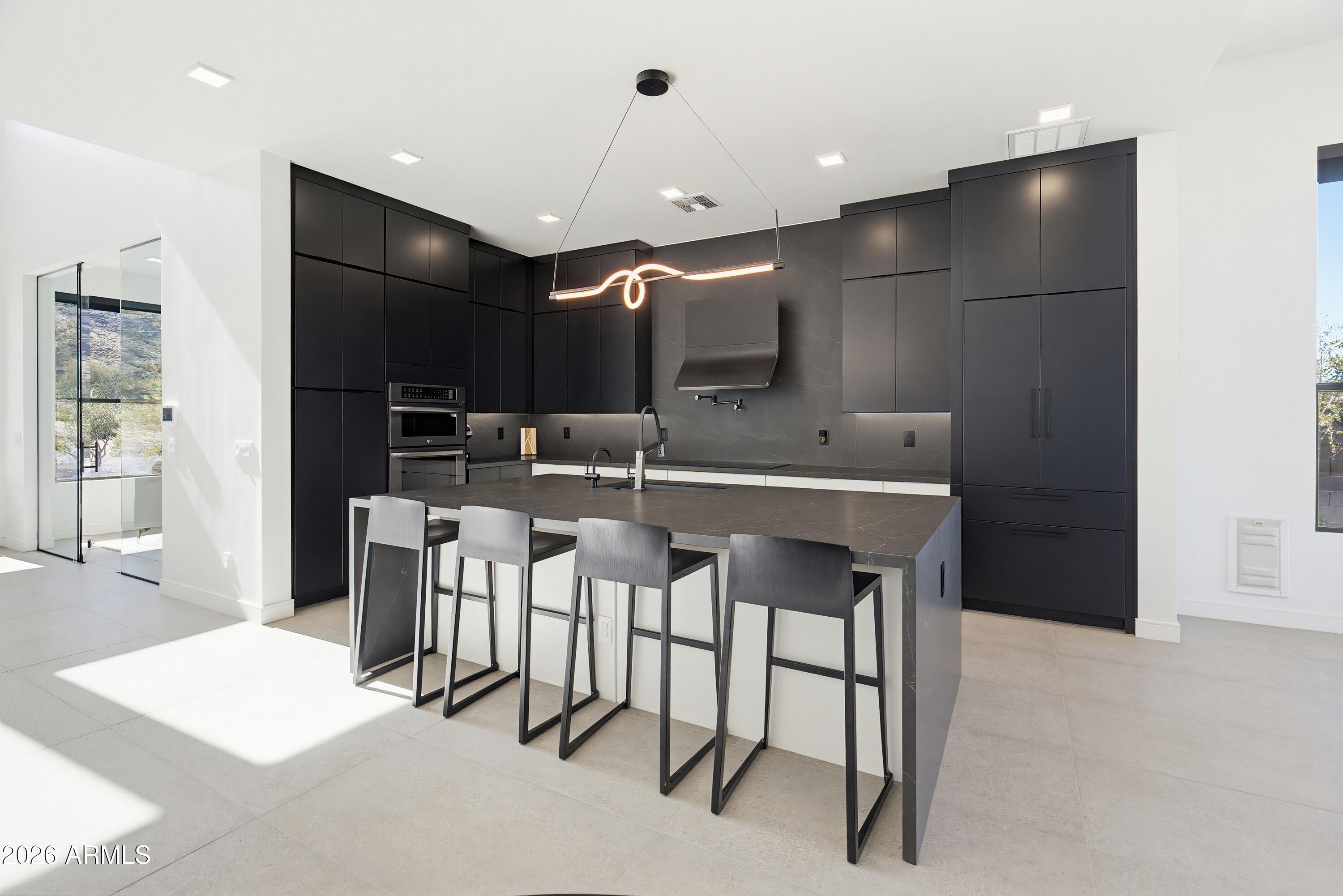 3350 East Highline Canal Road Phoenix, AZ 85042 - Photo 10 of 105 a kitchen with a dining table chairs and white cabinets