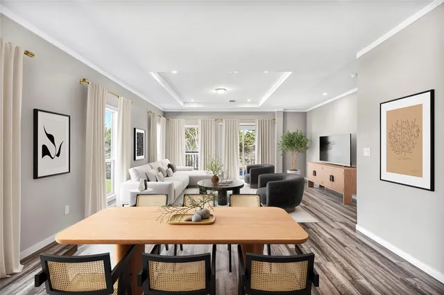 a view of a dining room with furniture window and wooden floor