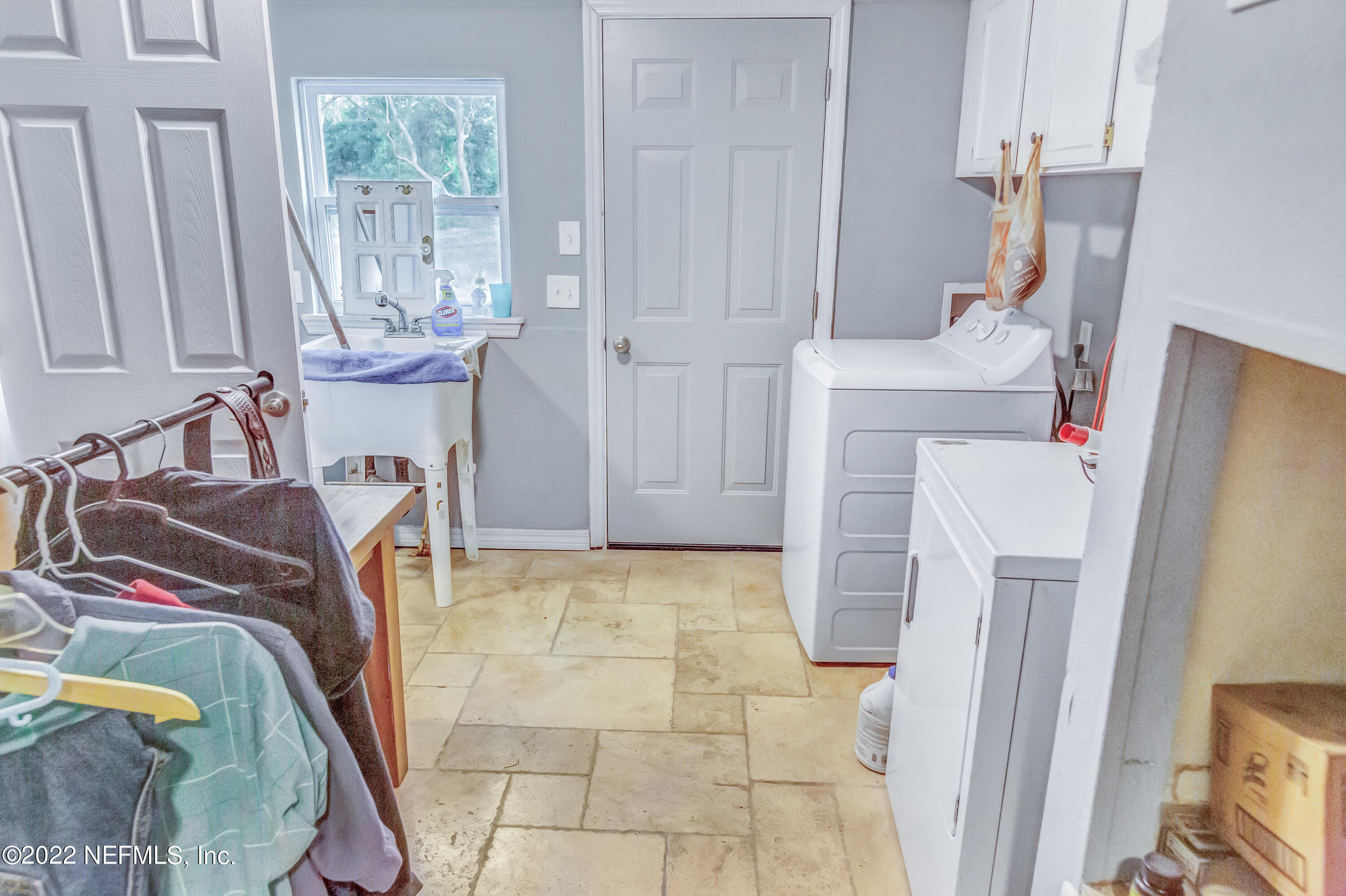 8049 Blazing Star Road Melrose, FL 32666 - Photo 23 of 39 a view of walk in closet with clothes and shoes