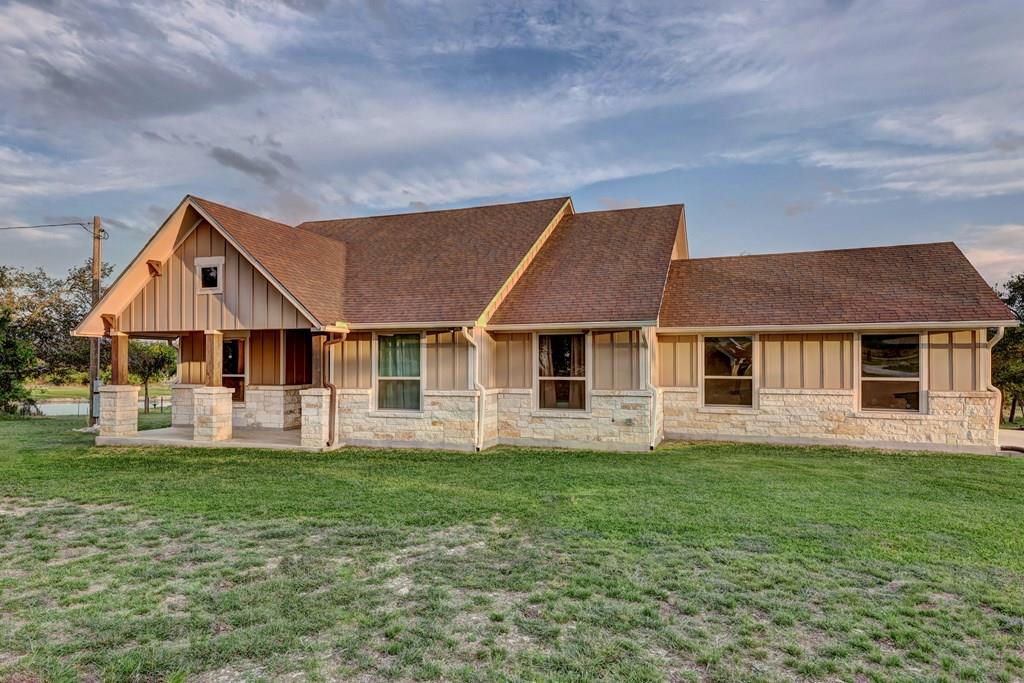 450 Jung Road Harper, TX 78631 - Photo 1 of 50 a front view of a house with a yard