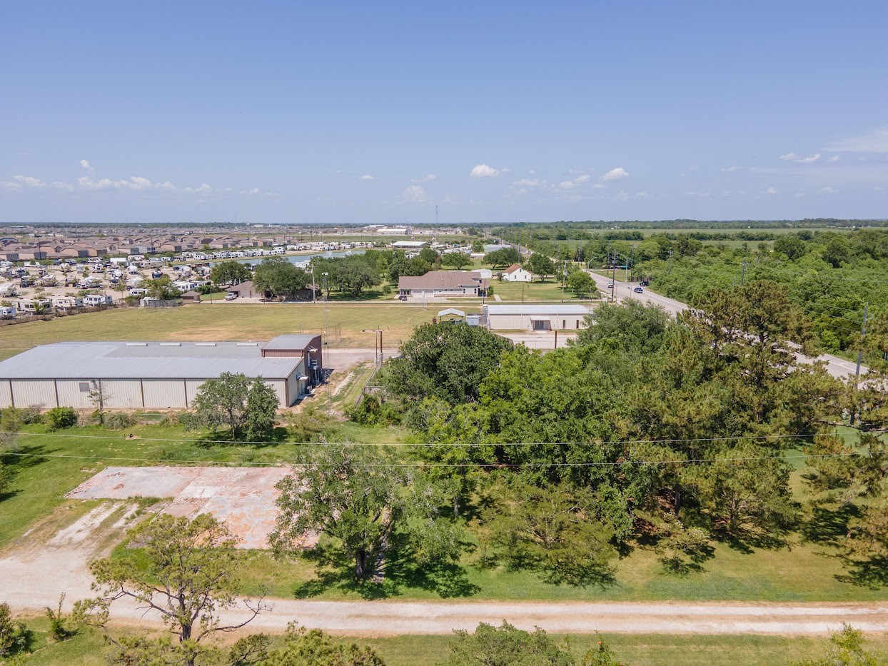 5707 South Farm-to-Market 565 Road Baytown, TX 77523 - Photo 14 of 18 a view of a lake with a city