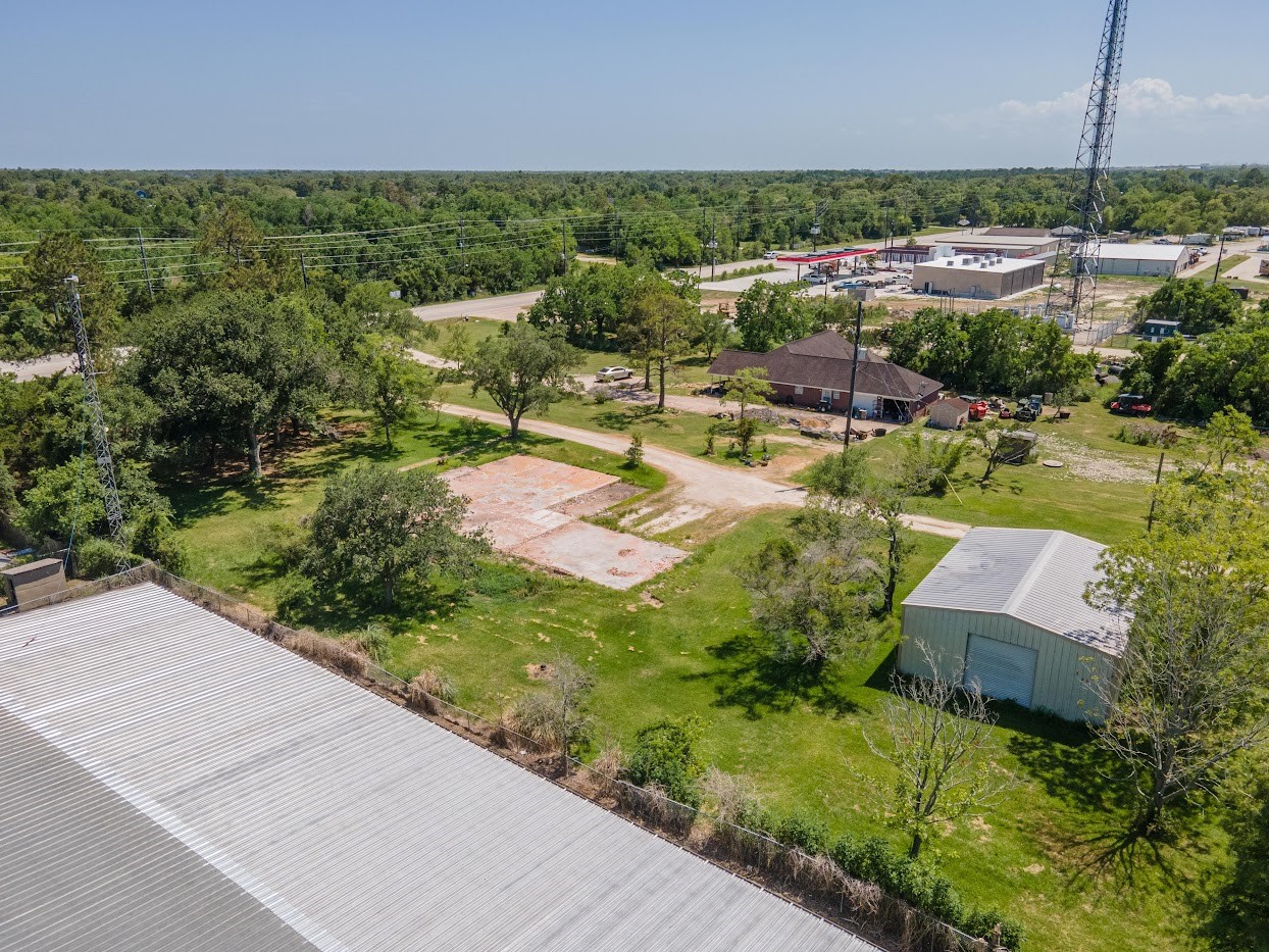 5707 South Farm-to-Market 565 Road Baytown, TX 77523 - Photo 18 of 18 an aerial view of a house with a garden and lake view