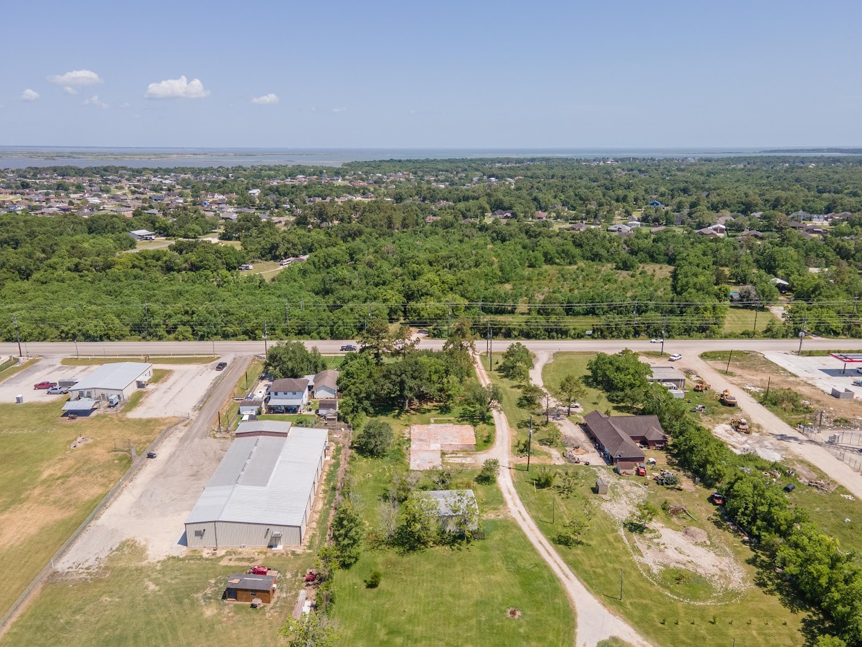 5707 South Farm-to-Market 565 Road Baytown, TX 77523 - Photo 8 of 18 an aerial view of a house with a yard