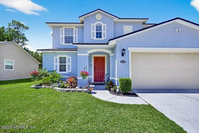 a front view of a house with a yard and porch