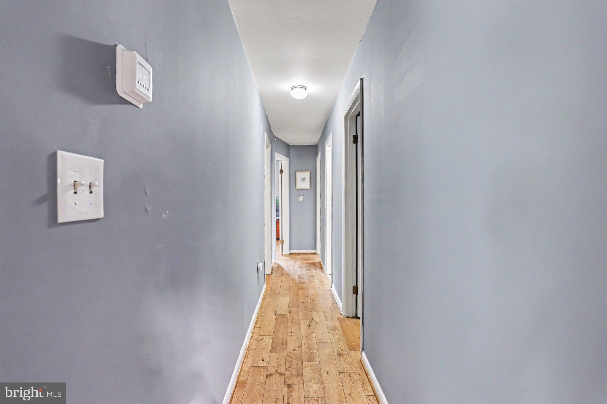 2226 Harney Road Littlestown, PA 17340 - Photo 15 of 40 a view of a hallway with wooden floor