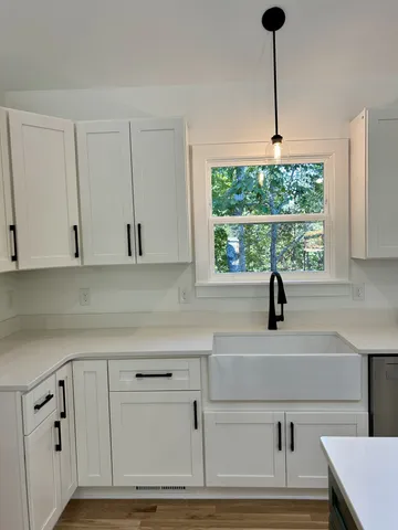 a kitchen with a window cabinets and appliances