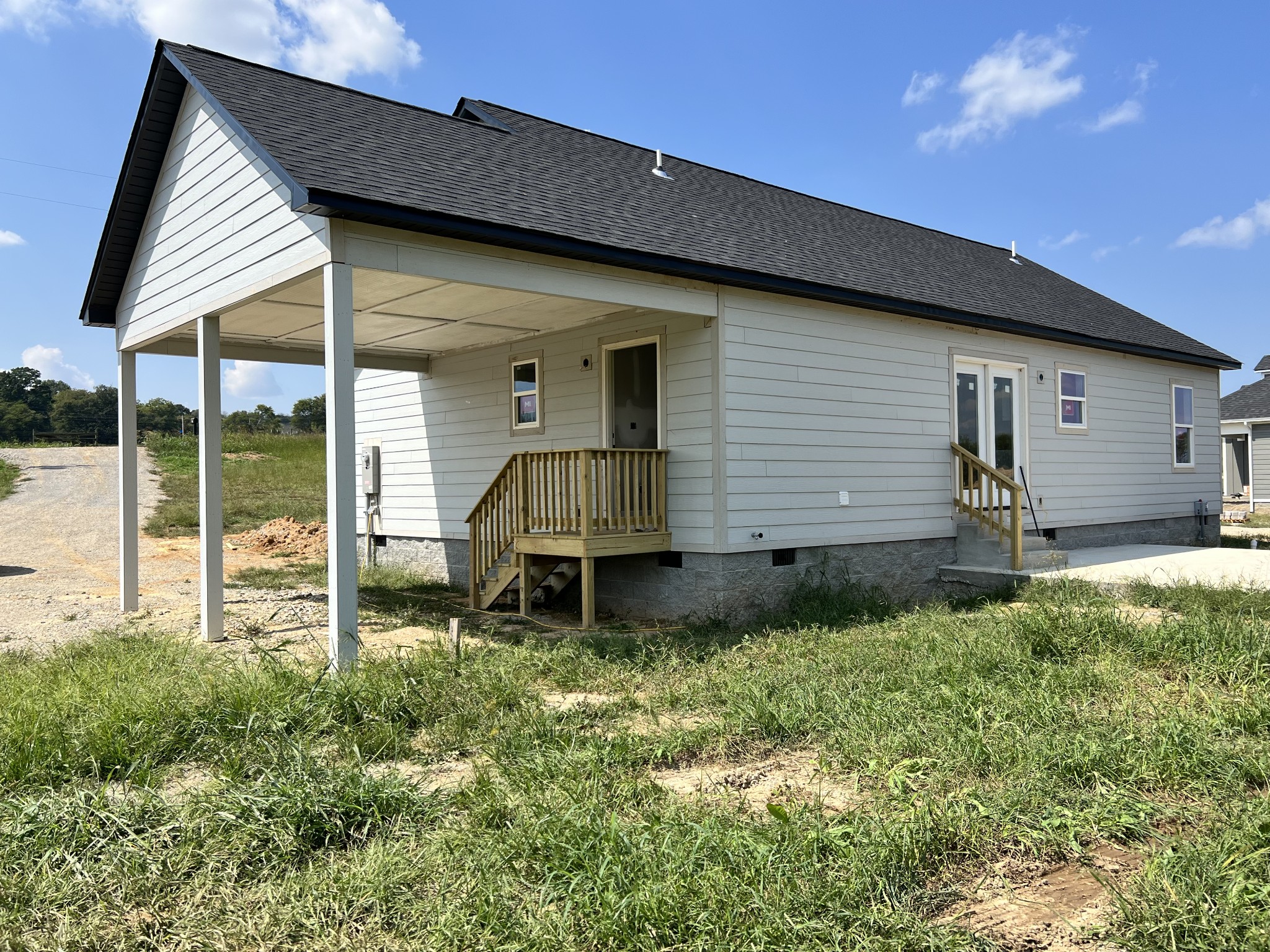9710 Campbellsville Road Pulaski, TN 38478 - Photo 21 of 22 a backyard of a house with table and chairs