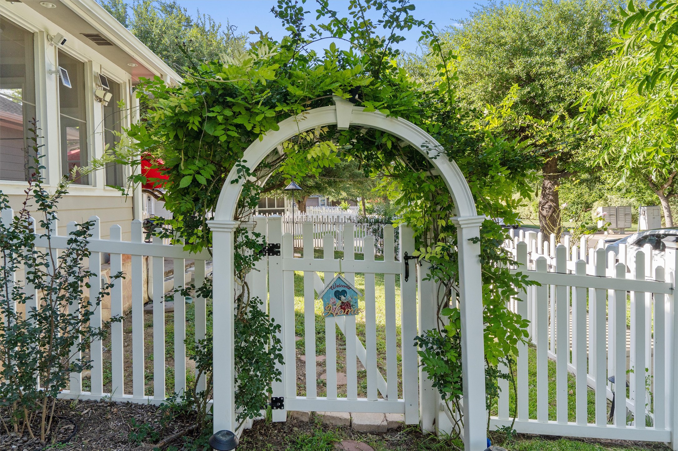 1833 Thompson Trail Round Rock, TX 78664 - Photo 33 of 40 Enter a delightful private yard through an arched, vine-covered picket gate.