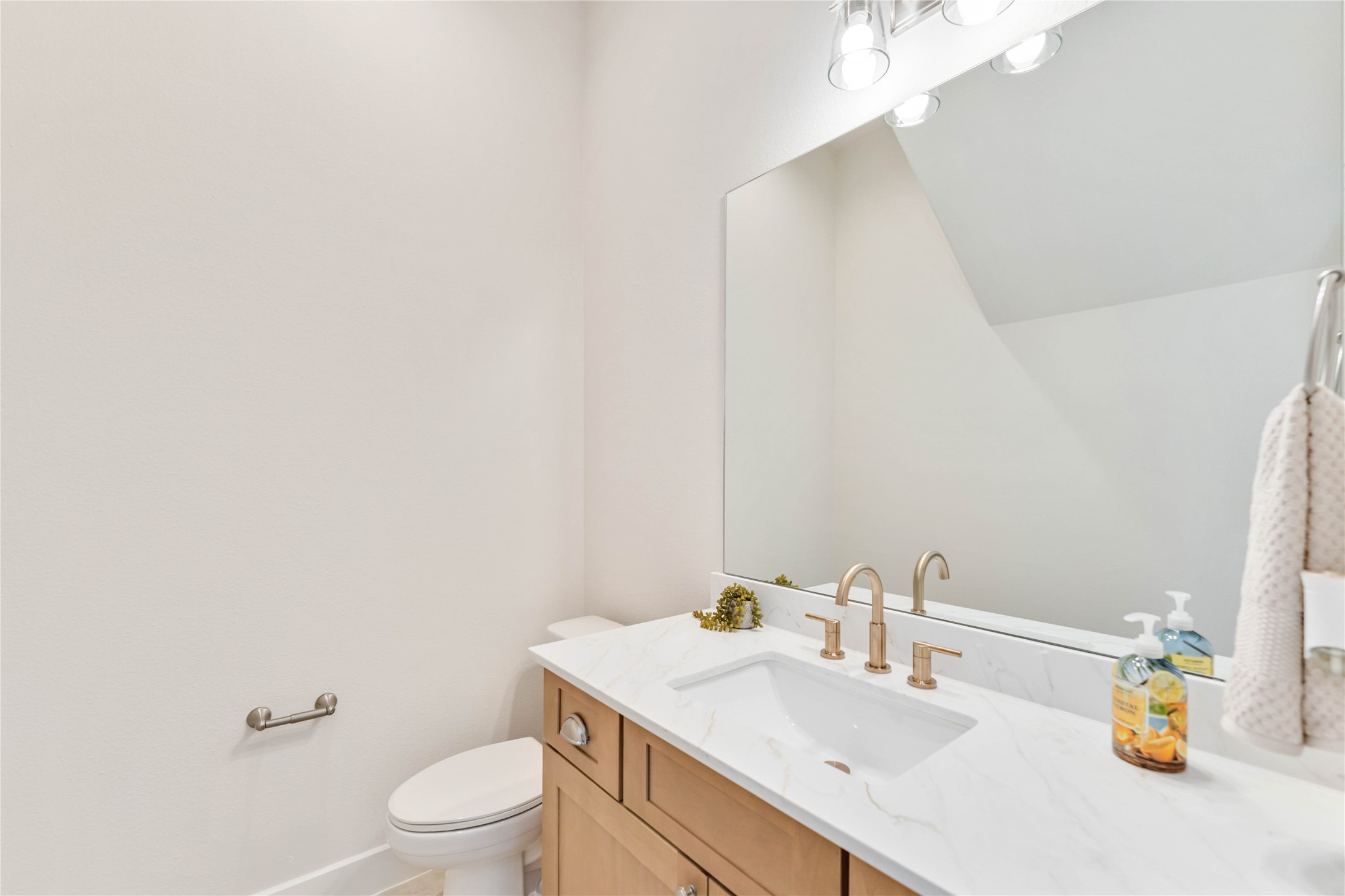 11108 Bauman Road Houston, TX 77076 - Photo 11 of 25 a bathroom with a sink a toilet and a mirror