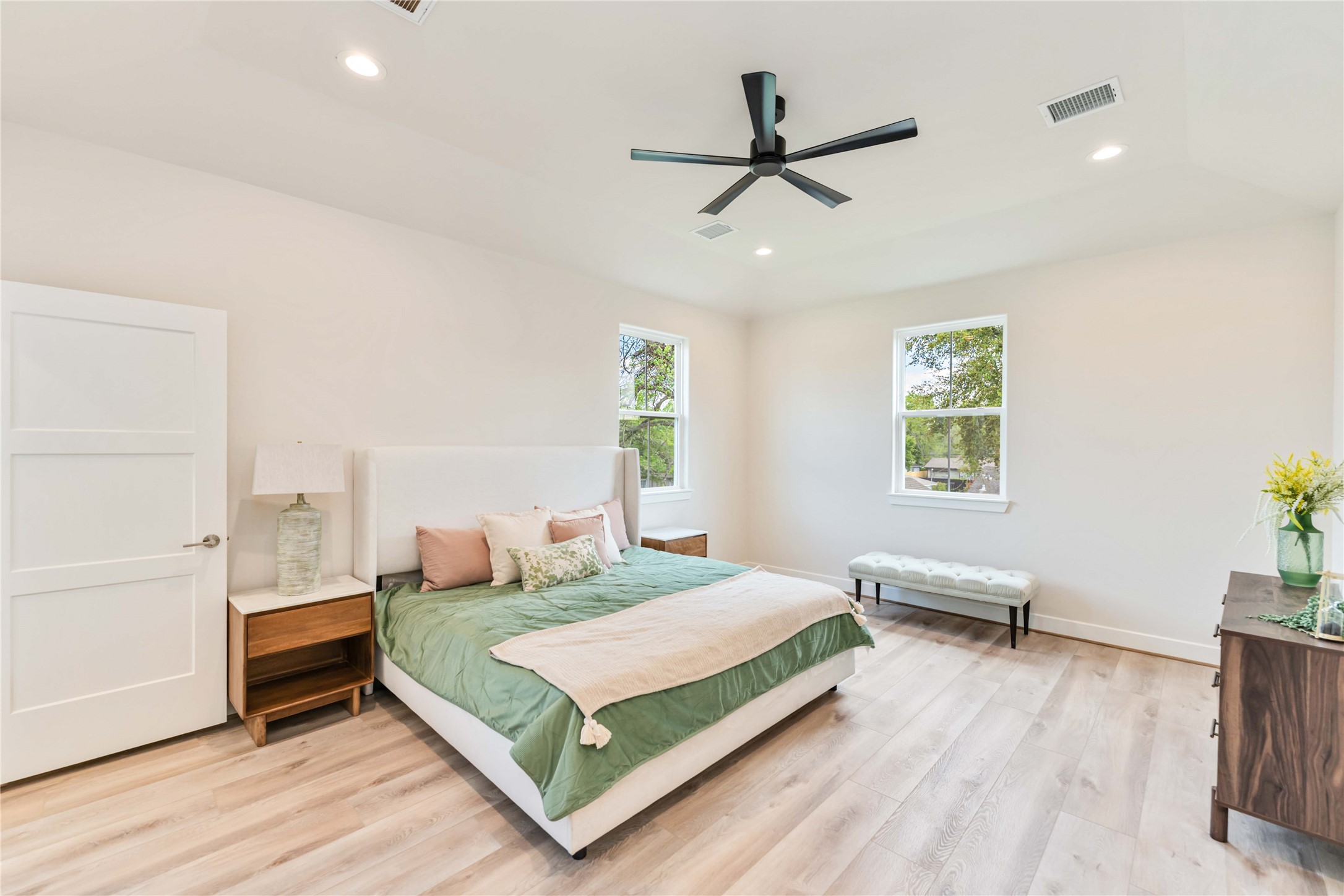 11108 Bauman Road Houston, TX 77076 - Photo 12 of 25 a bedroom with a bed and a window
