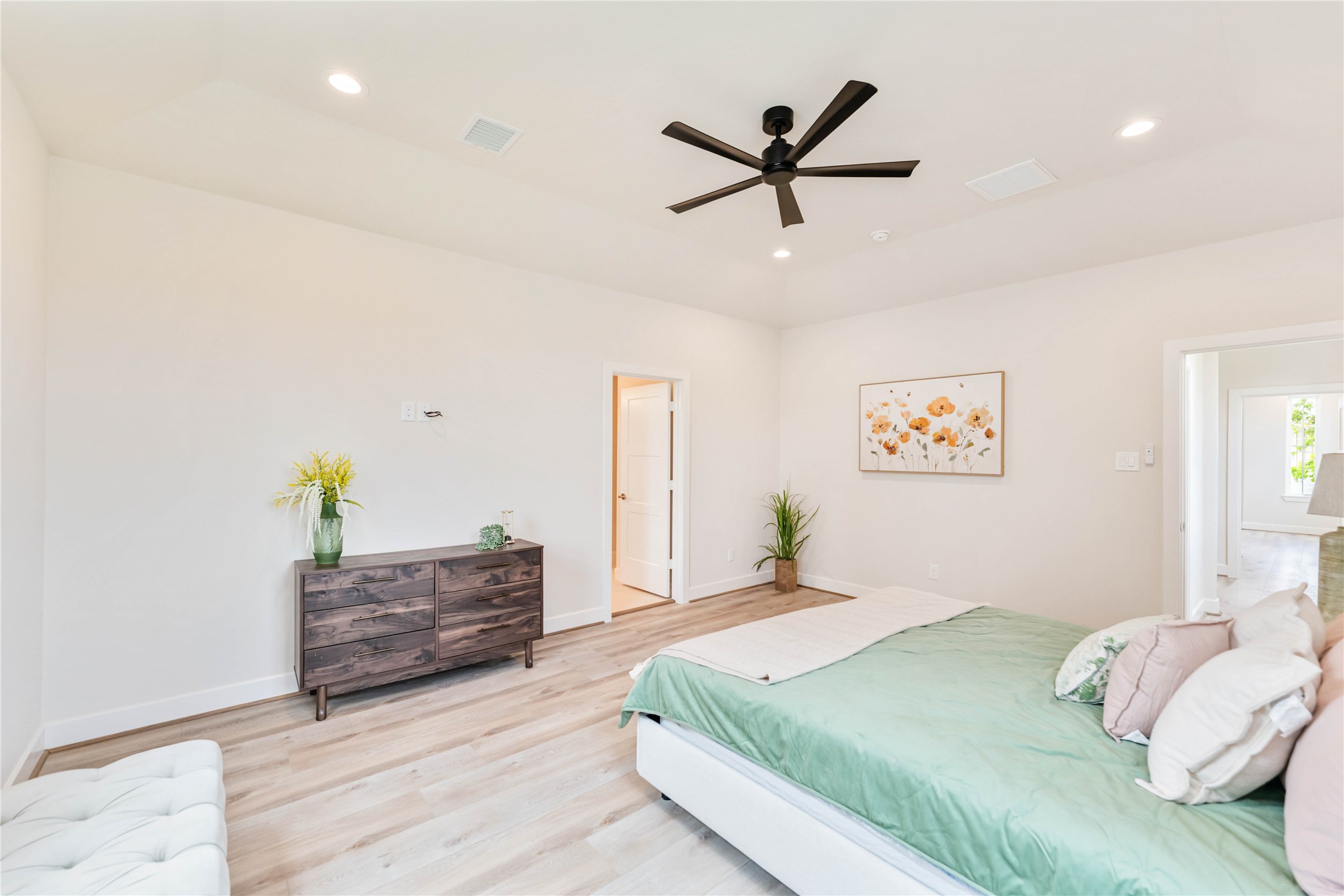 11108 Bauman Road Houston, TX 77076 - Photo 13 of 25 a bedroom with a bed and a dresser